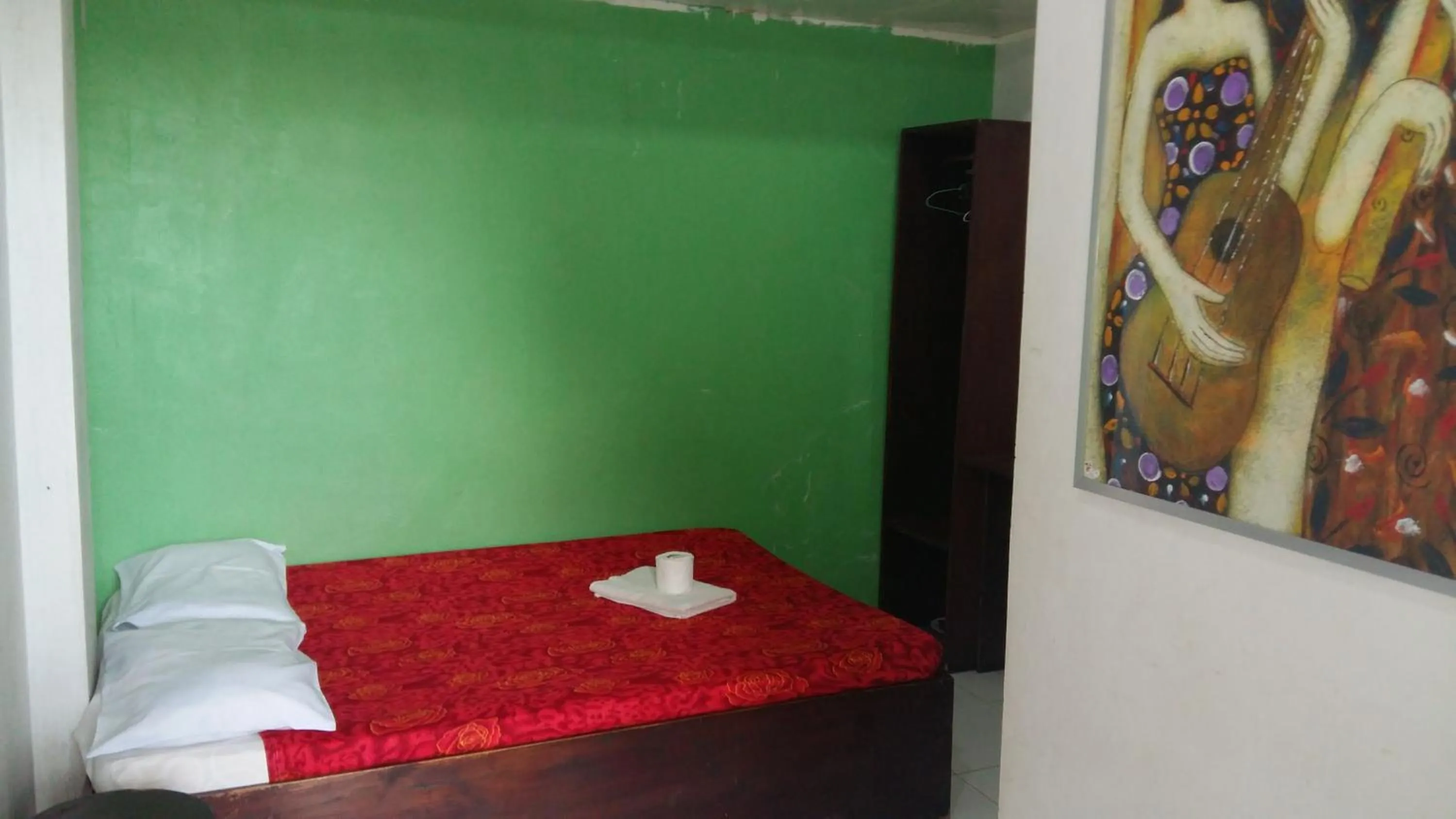 Bed in Antonio's Pension House