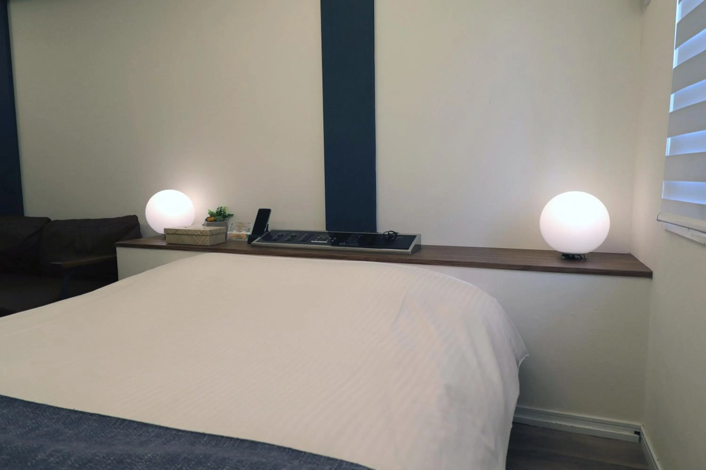 Bed in 天然個室温泉 HOTEL Lafontaine 諏訪