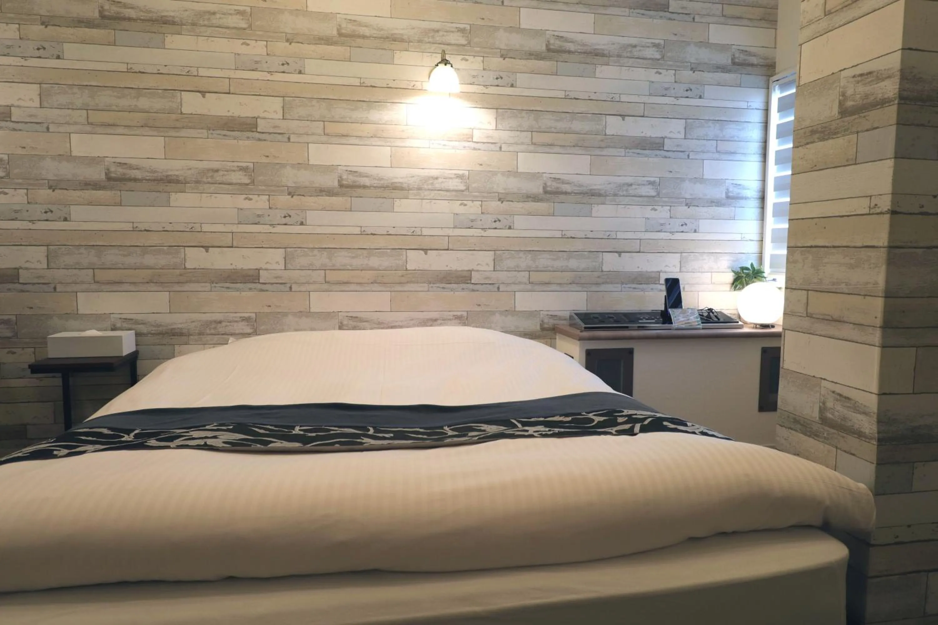 Bed in 天然個室温泉 HOTEL Lafontaine 諏訪