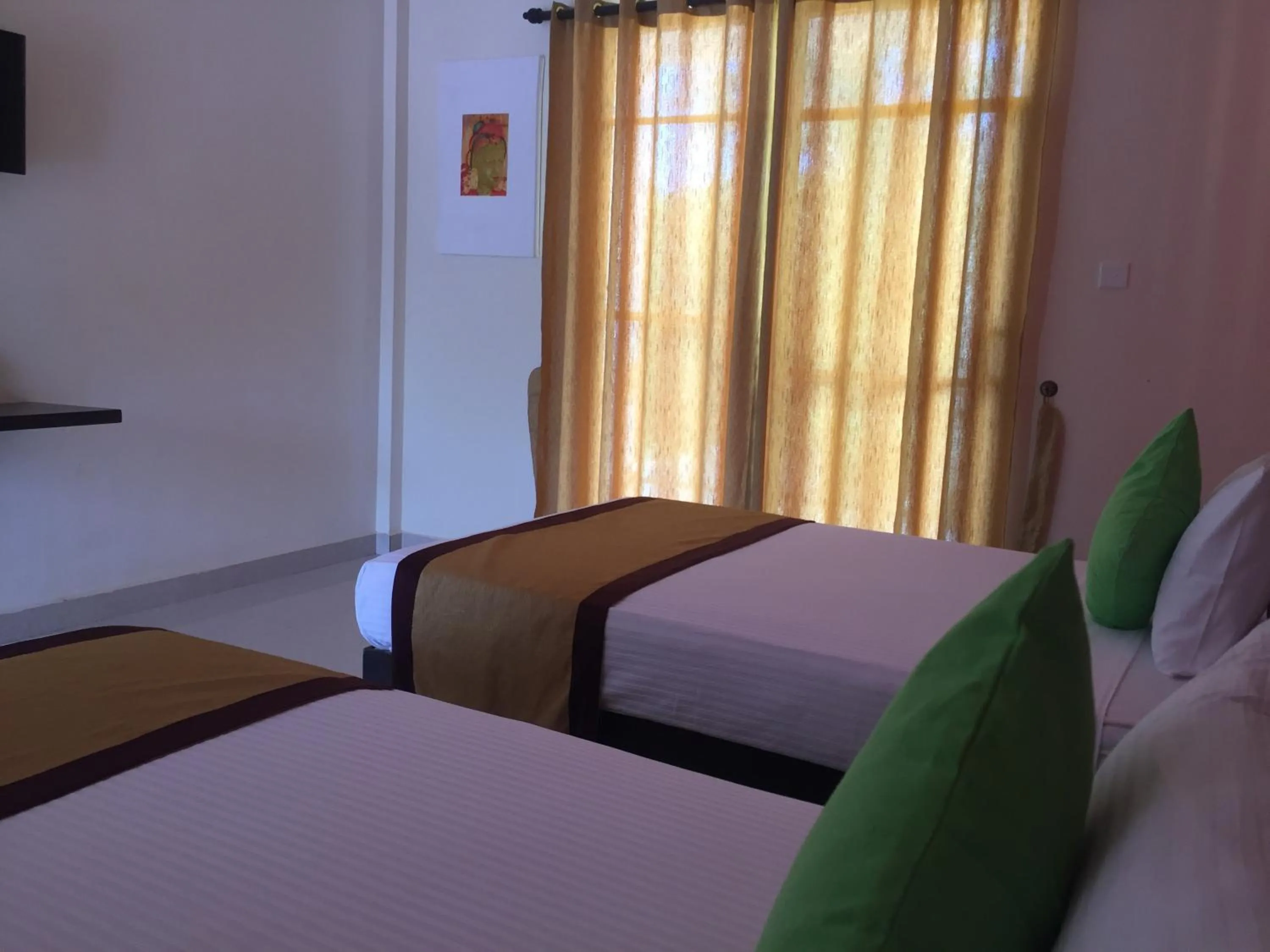 Bed in Organic Garden Resort Sigiriya