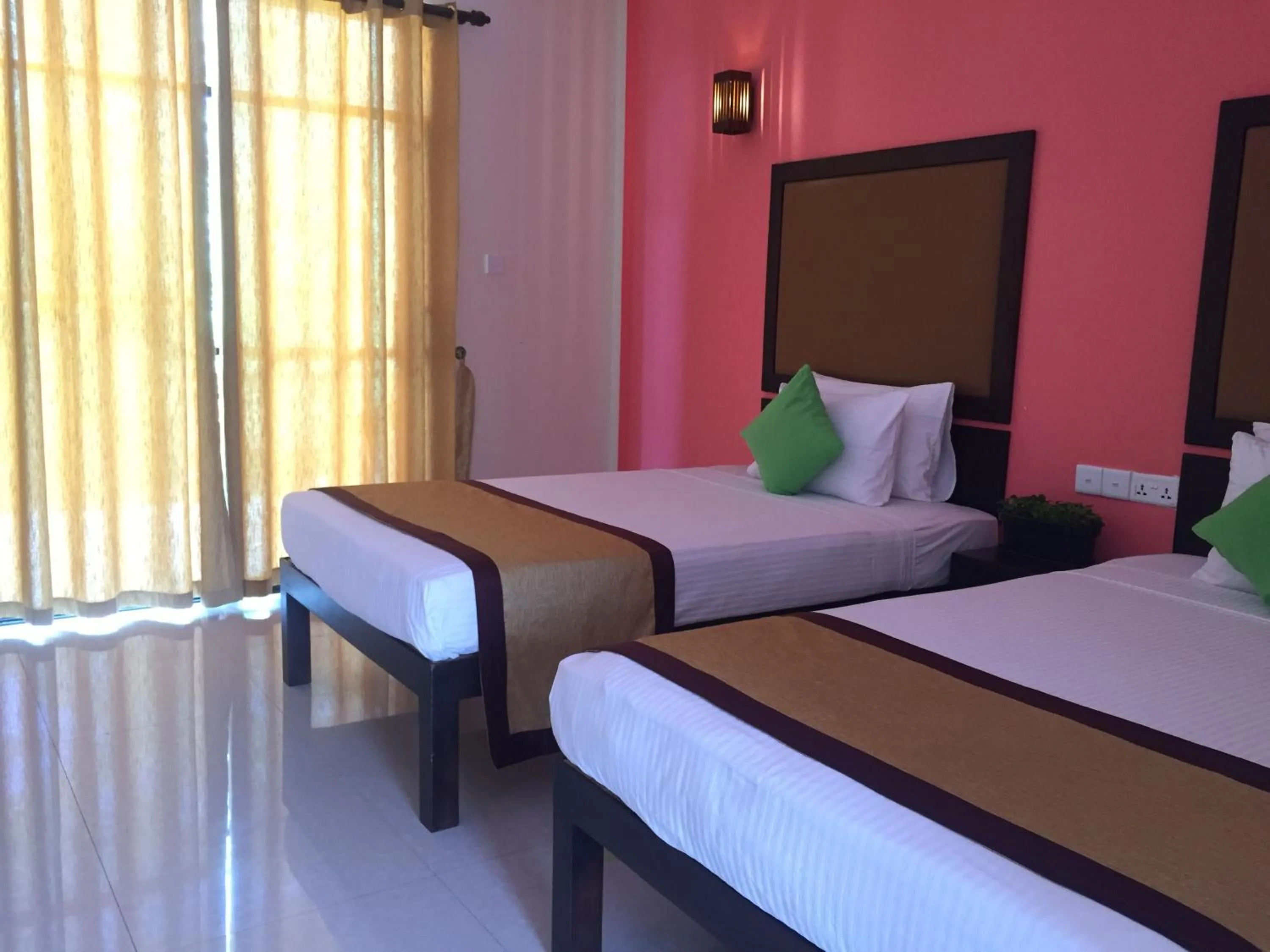 Bed in Organic Garden Resort Sigiriya