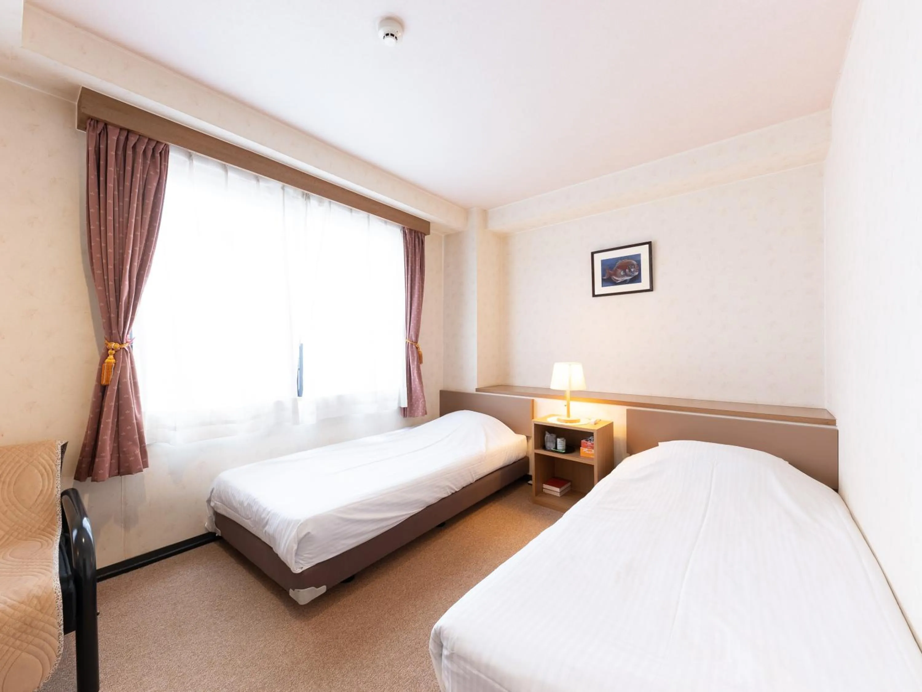 Bed in Tabist Business Hotel R Side Kanazawa