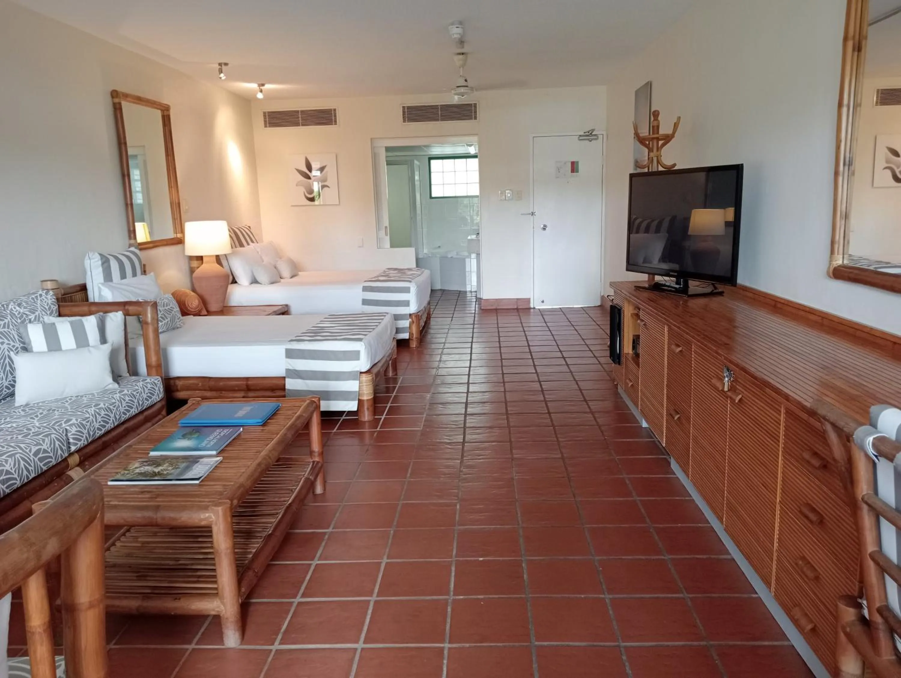 Bed in Club Tropical Resort - Official Onsite Reception & Check In