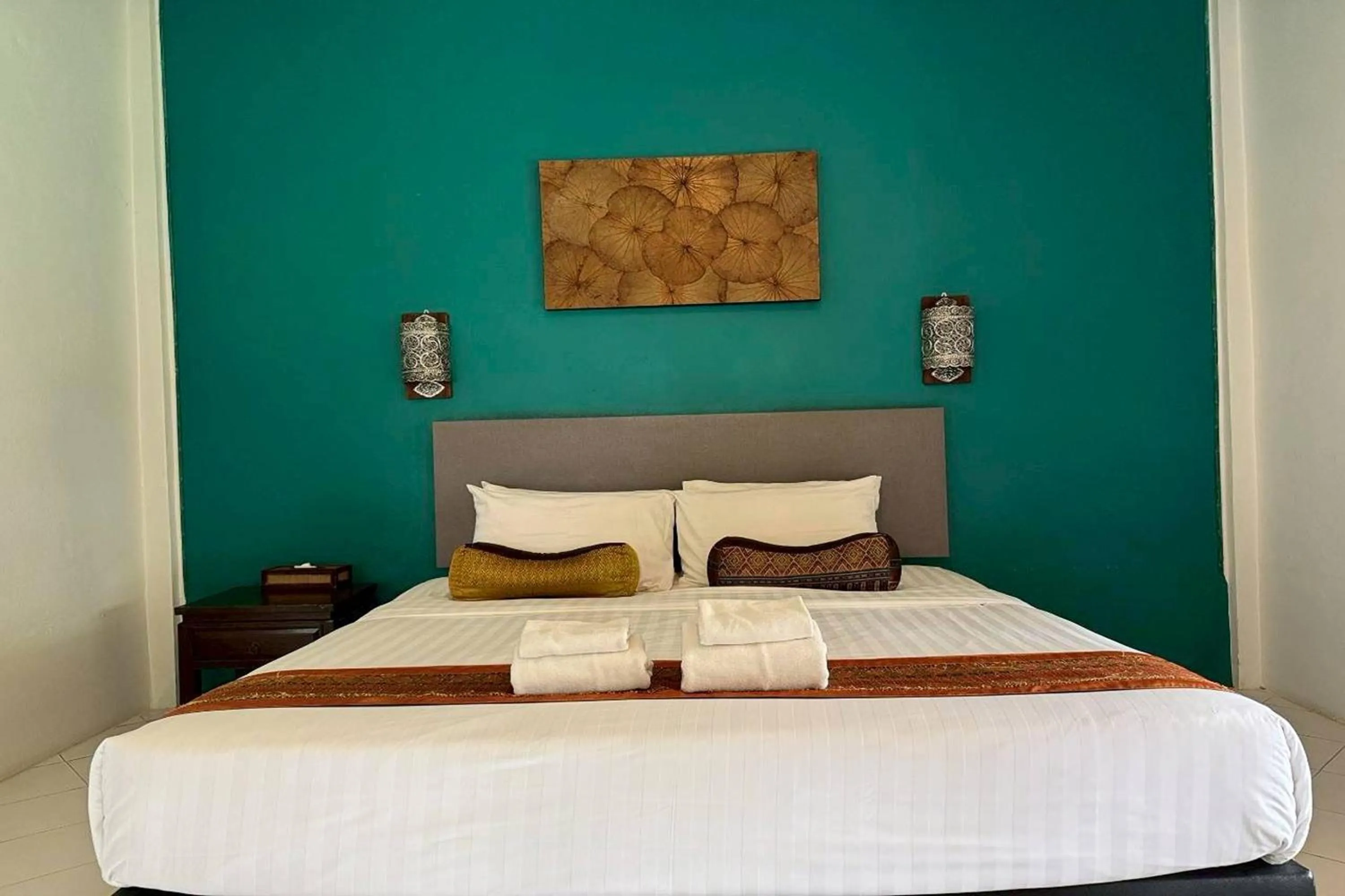 Bed in Poonyamantra Resort Chiang Rai