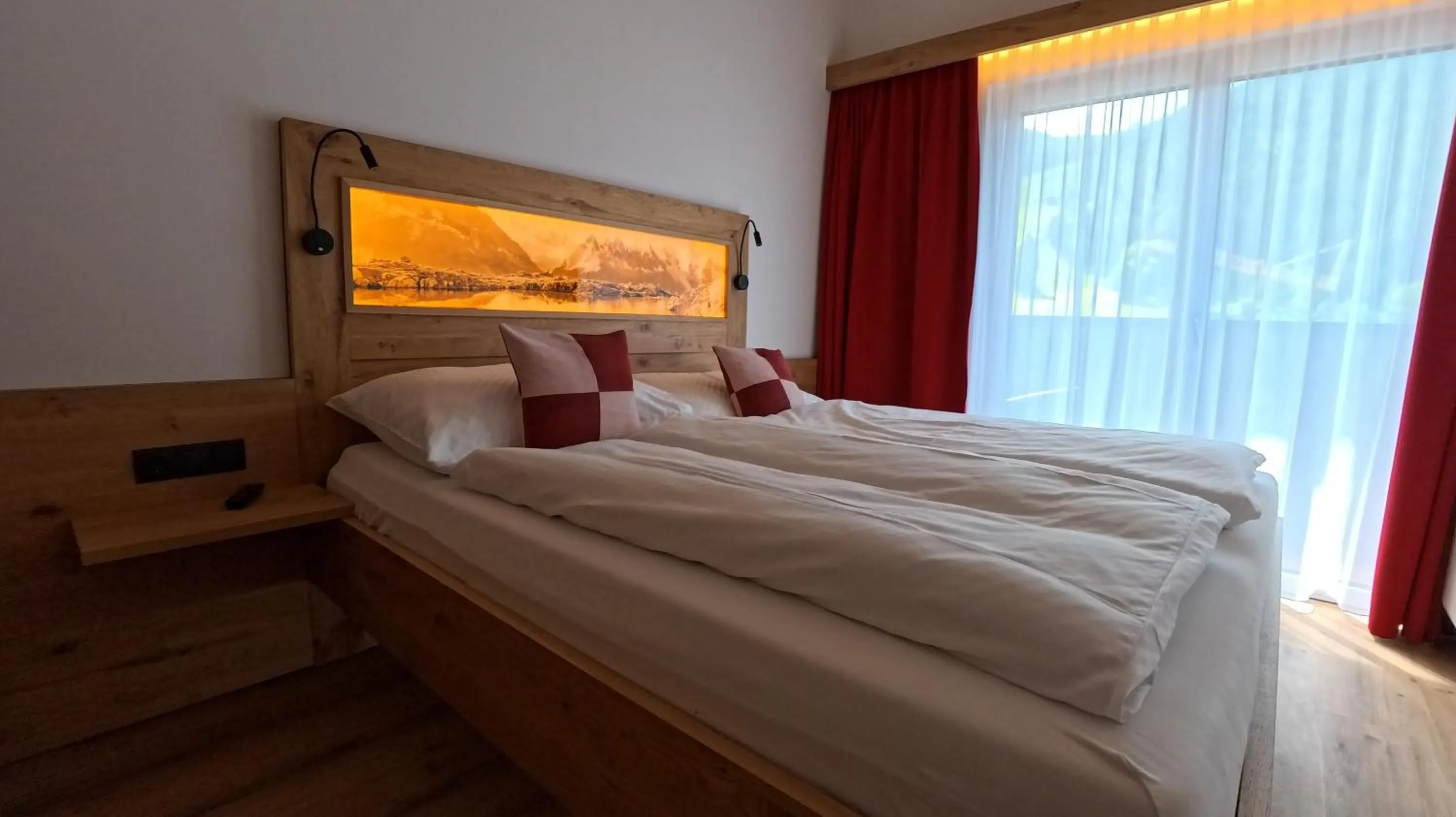 Bed in Ferienwohnungen Starchenthof - Wildschönau, Premiumcard inclusive