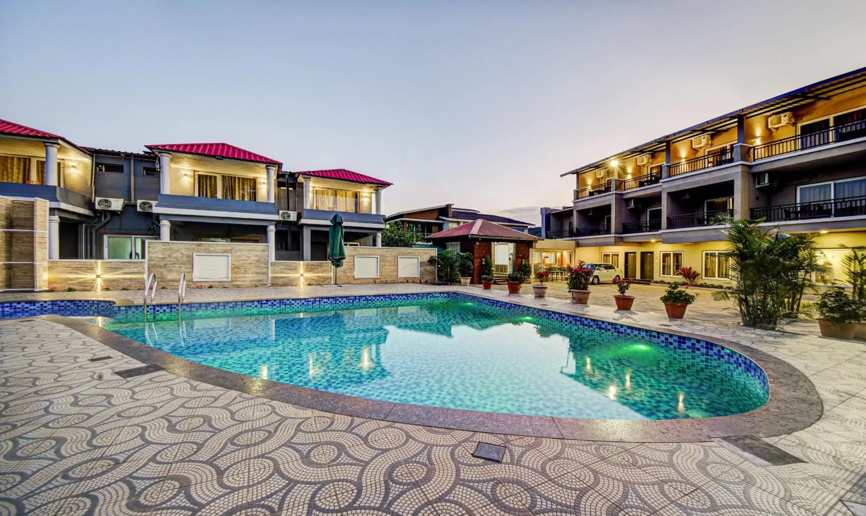 Pool view in Treebo JP Cottage Pool view in Treebo JP Cottage