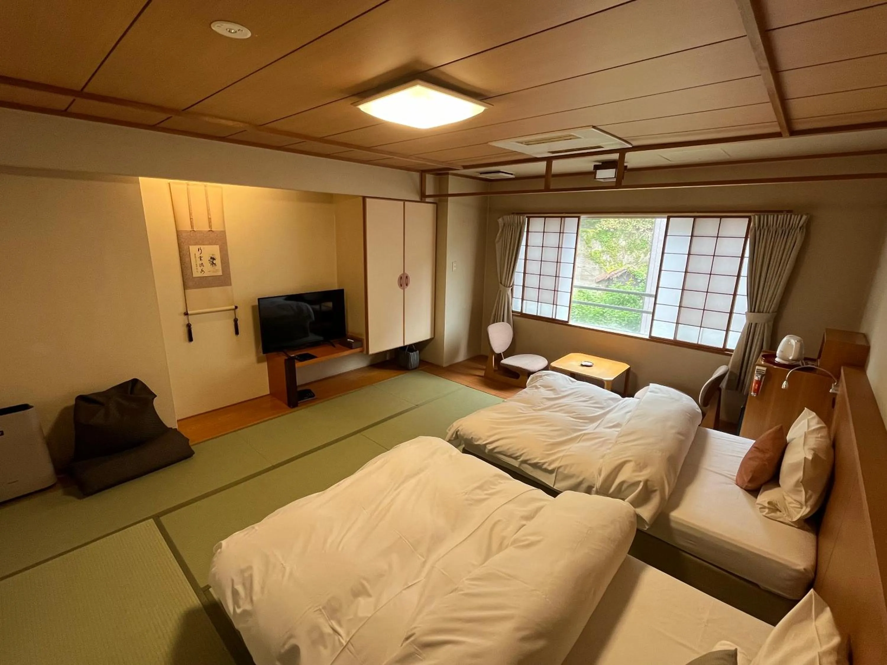Living room, Bed in Takinoya Bekkan Tamanoyu