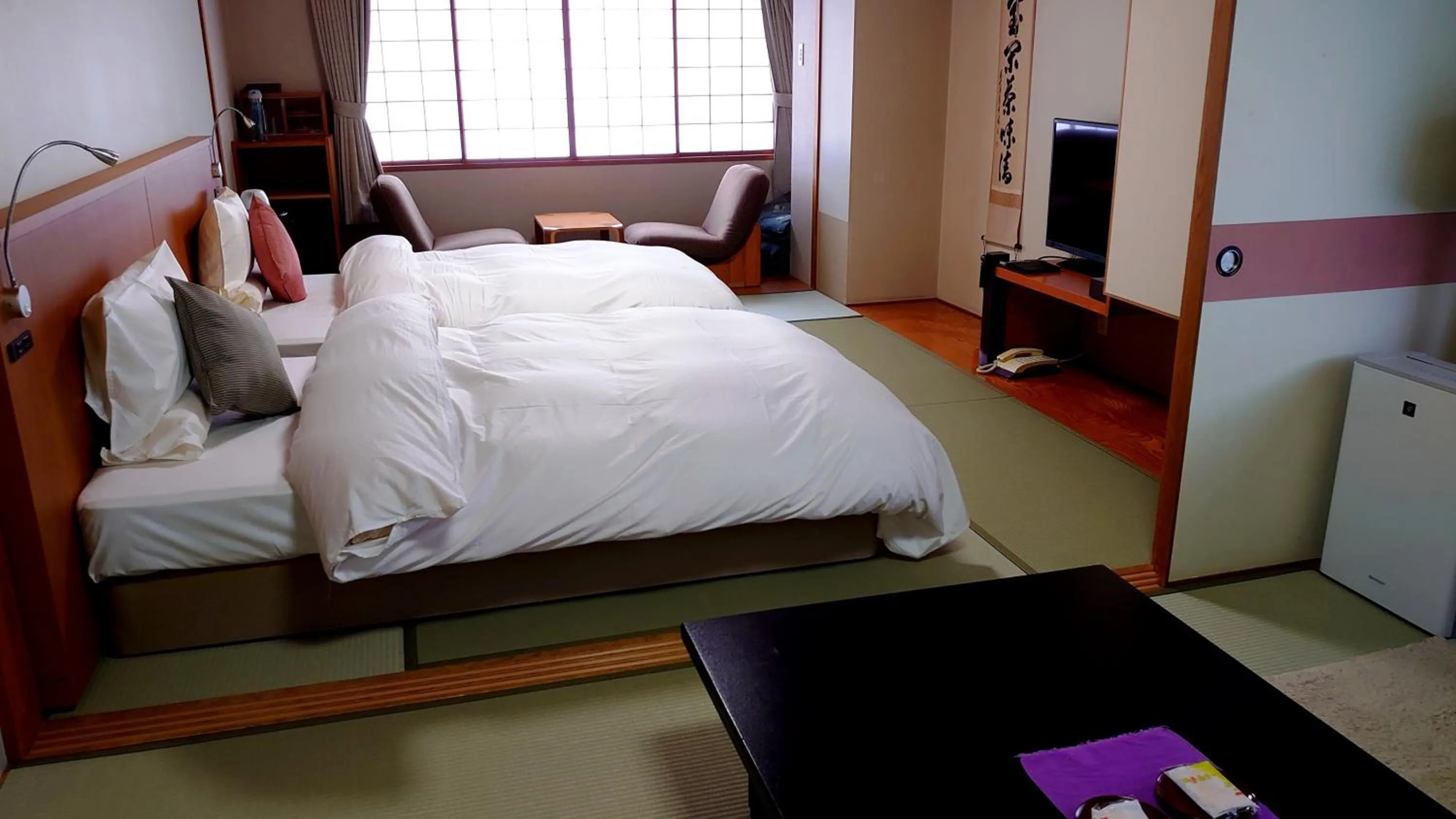 Photo of the whole room, Bed in Takinoya Bekkan Tamanoyu
