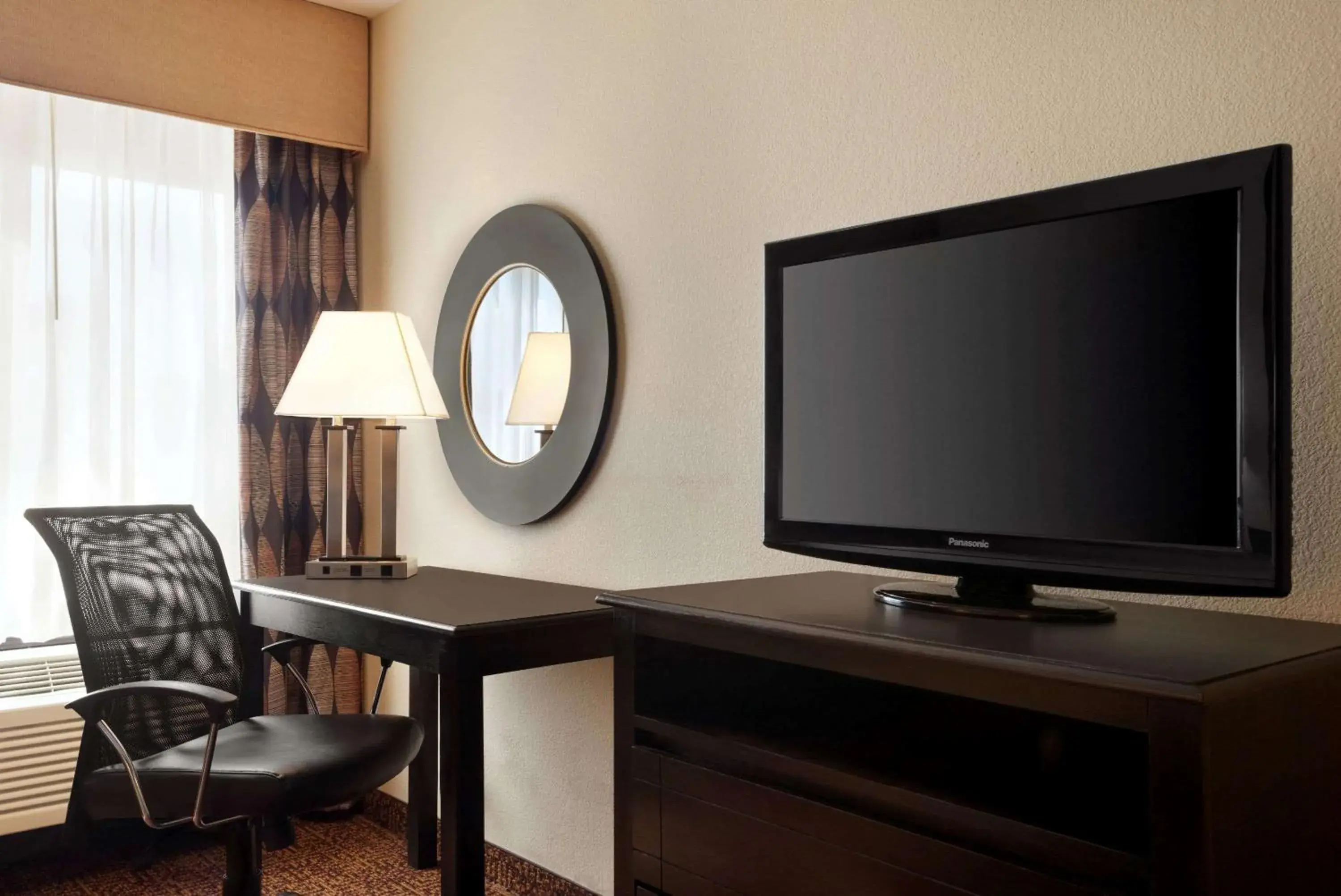 Photo of the whole room, TV/Entertainment Center in Super 8 by Wyndham Des Moines