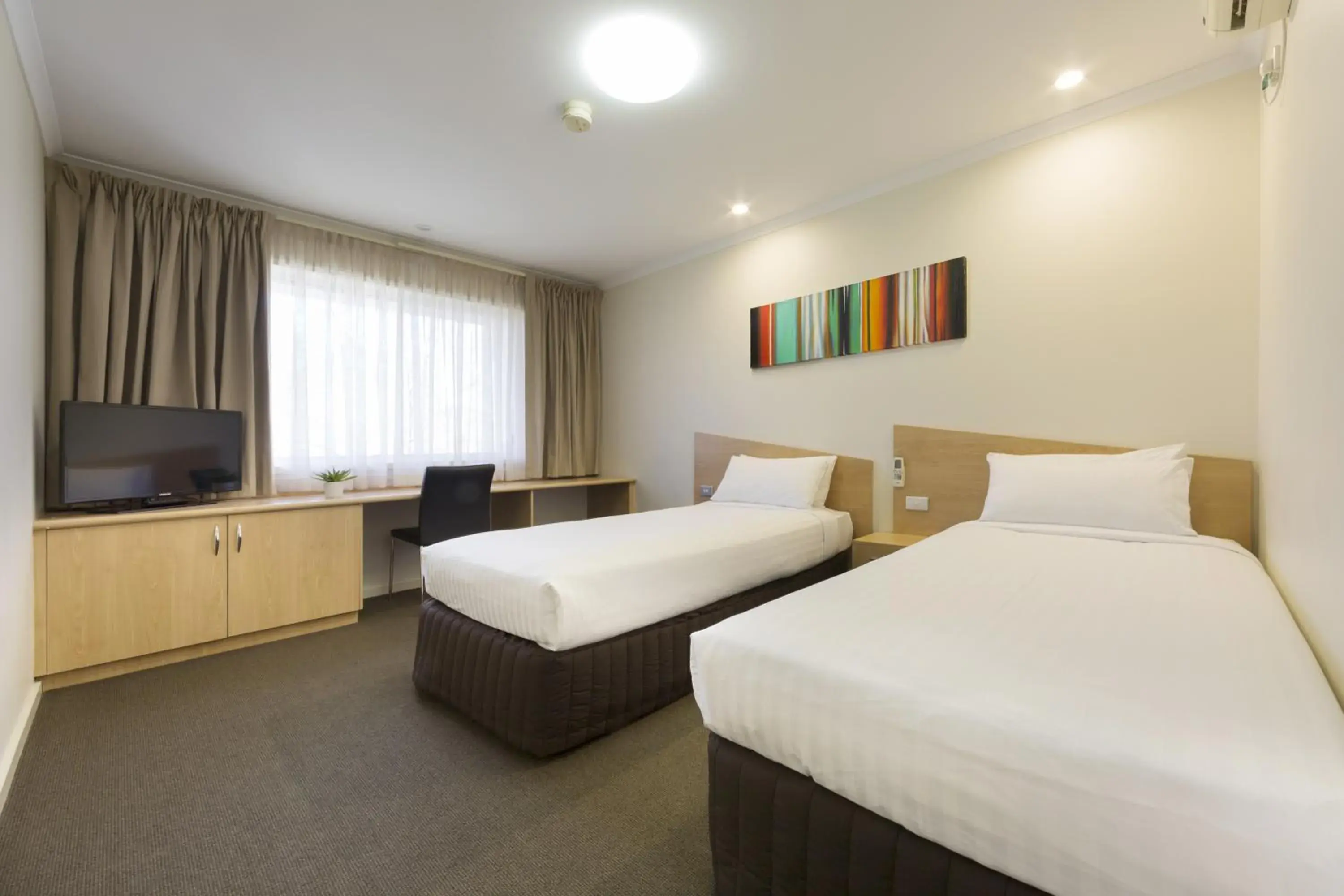 Bedroom in Ramada Encore by Wyndham Belconnen Canberra Bedroom in Ramada Encore by Wyndham Belconnen Canberra