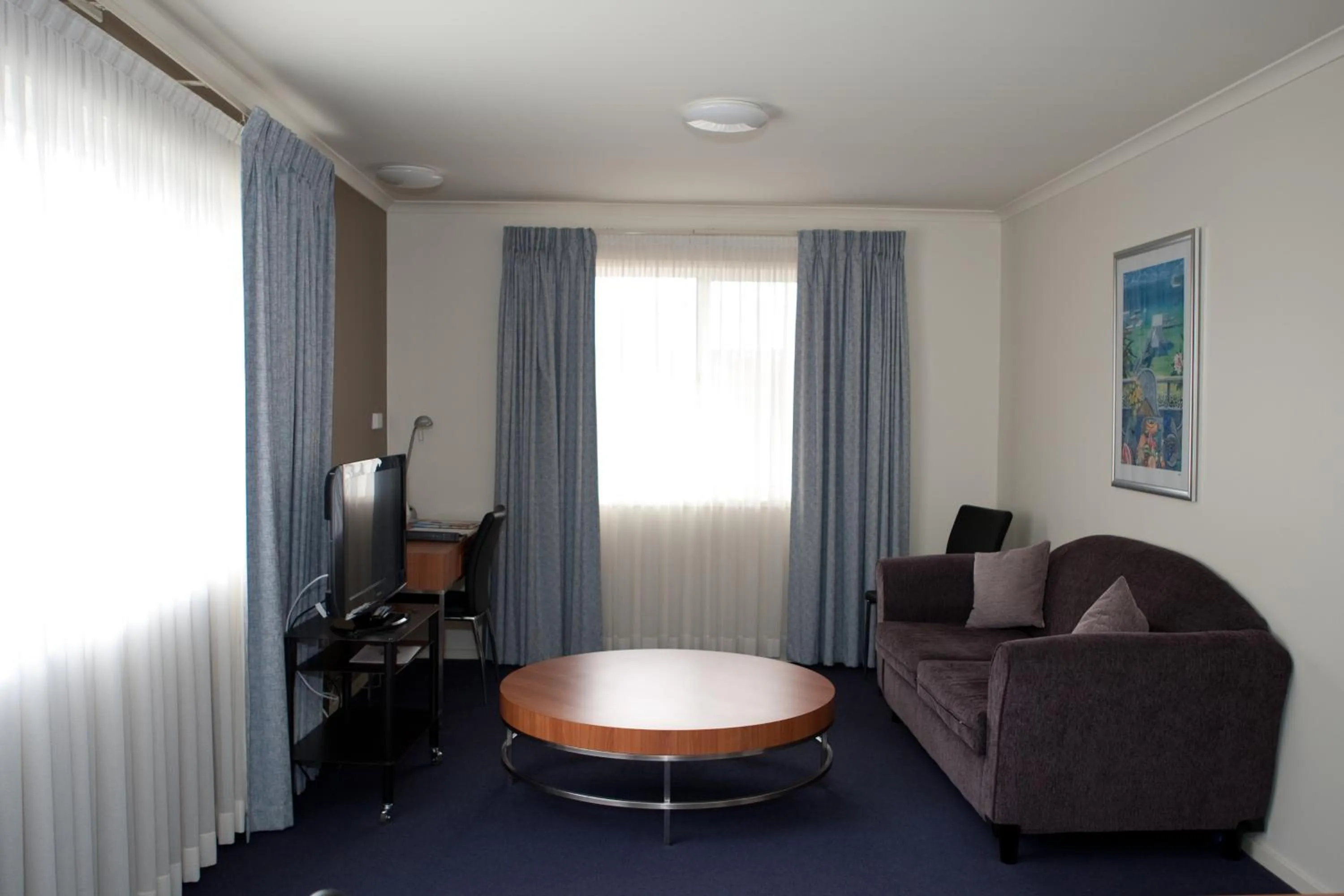 Living room in Ramada Encore by Wyndham Belconnen Canberra