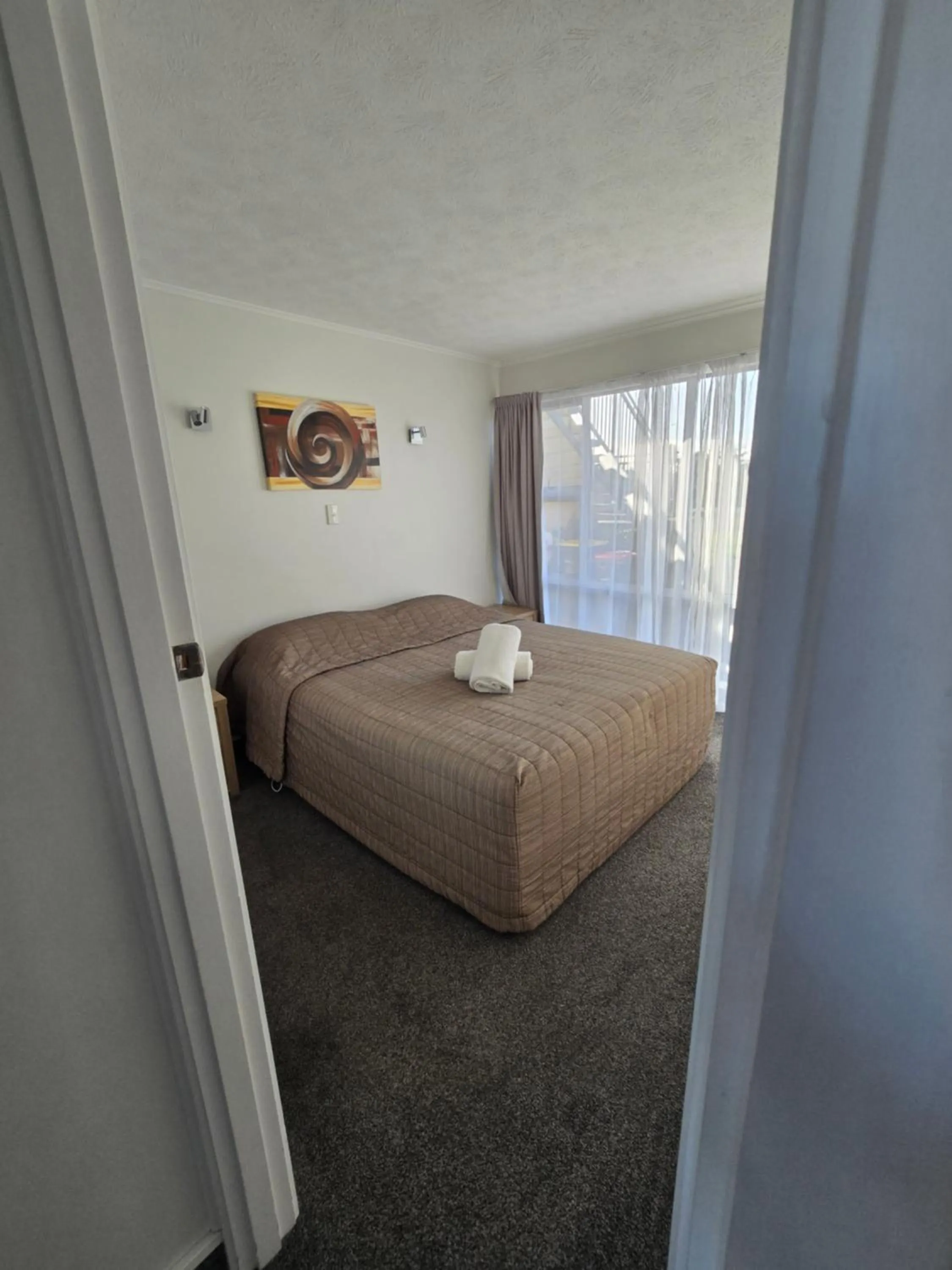 Bed in Monarch Motel