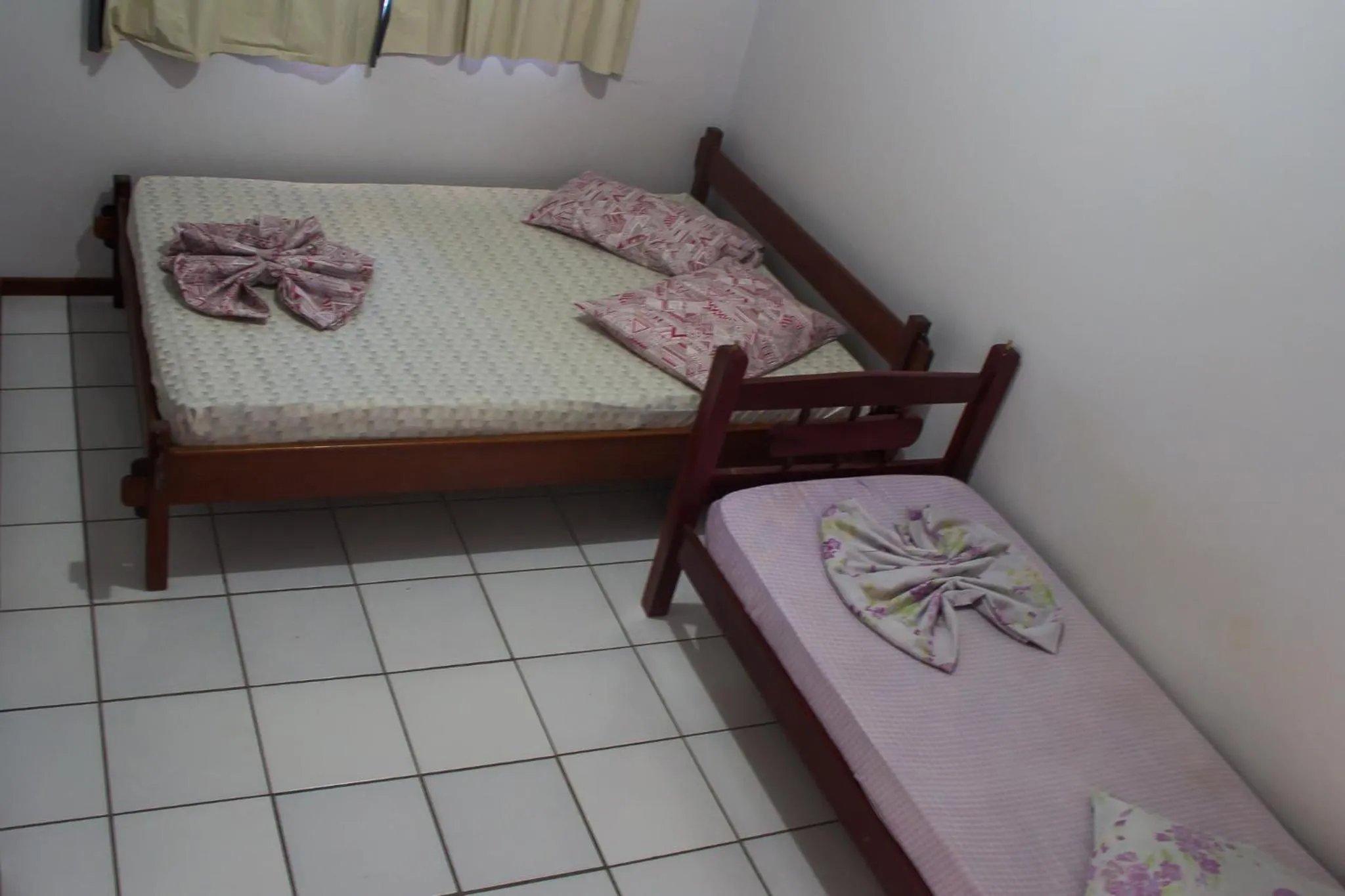 Bed in Pousada Oliveira Guarda do Embaú