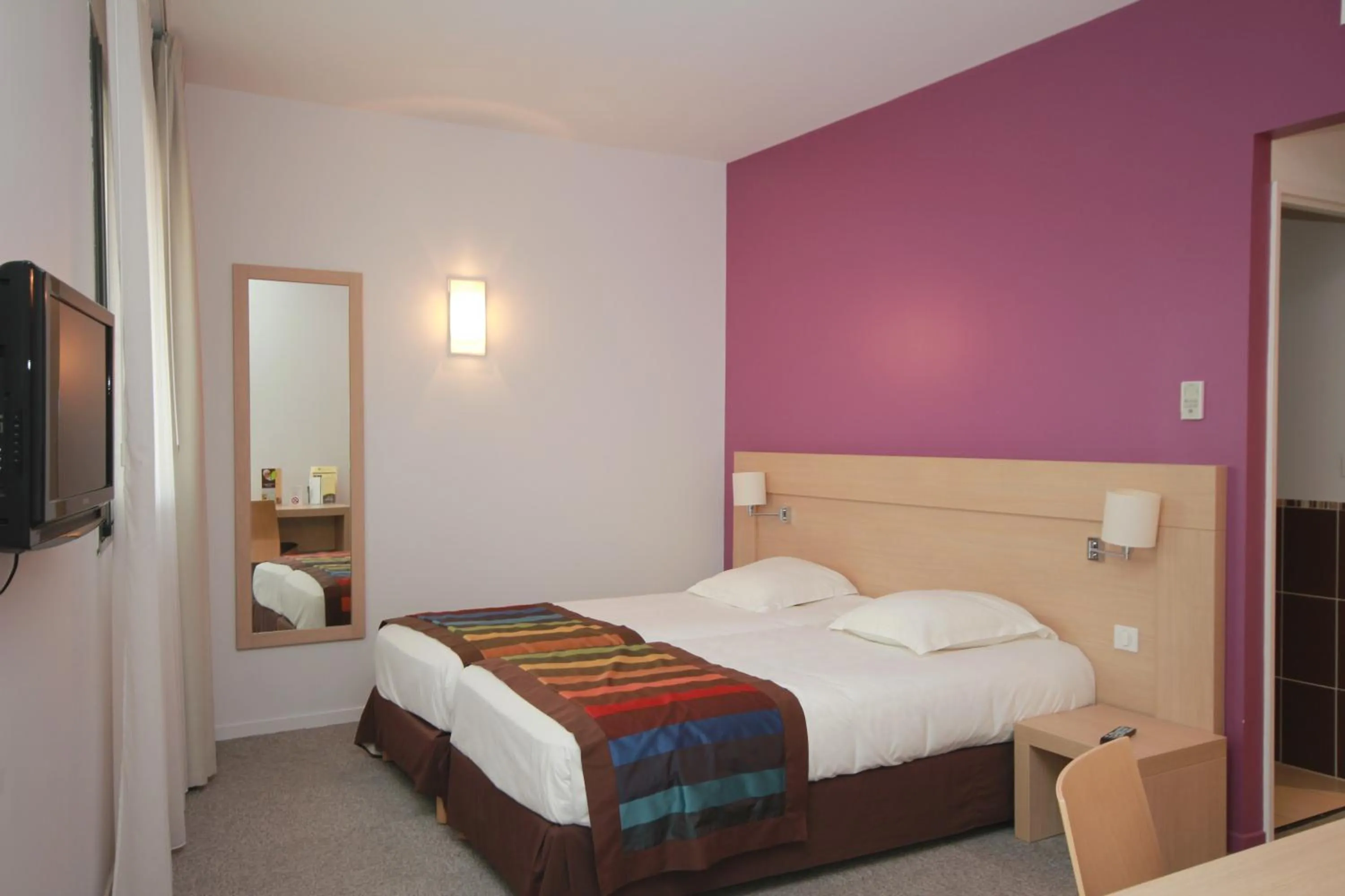 Bed in Esatitude Hotel