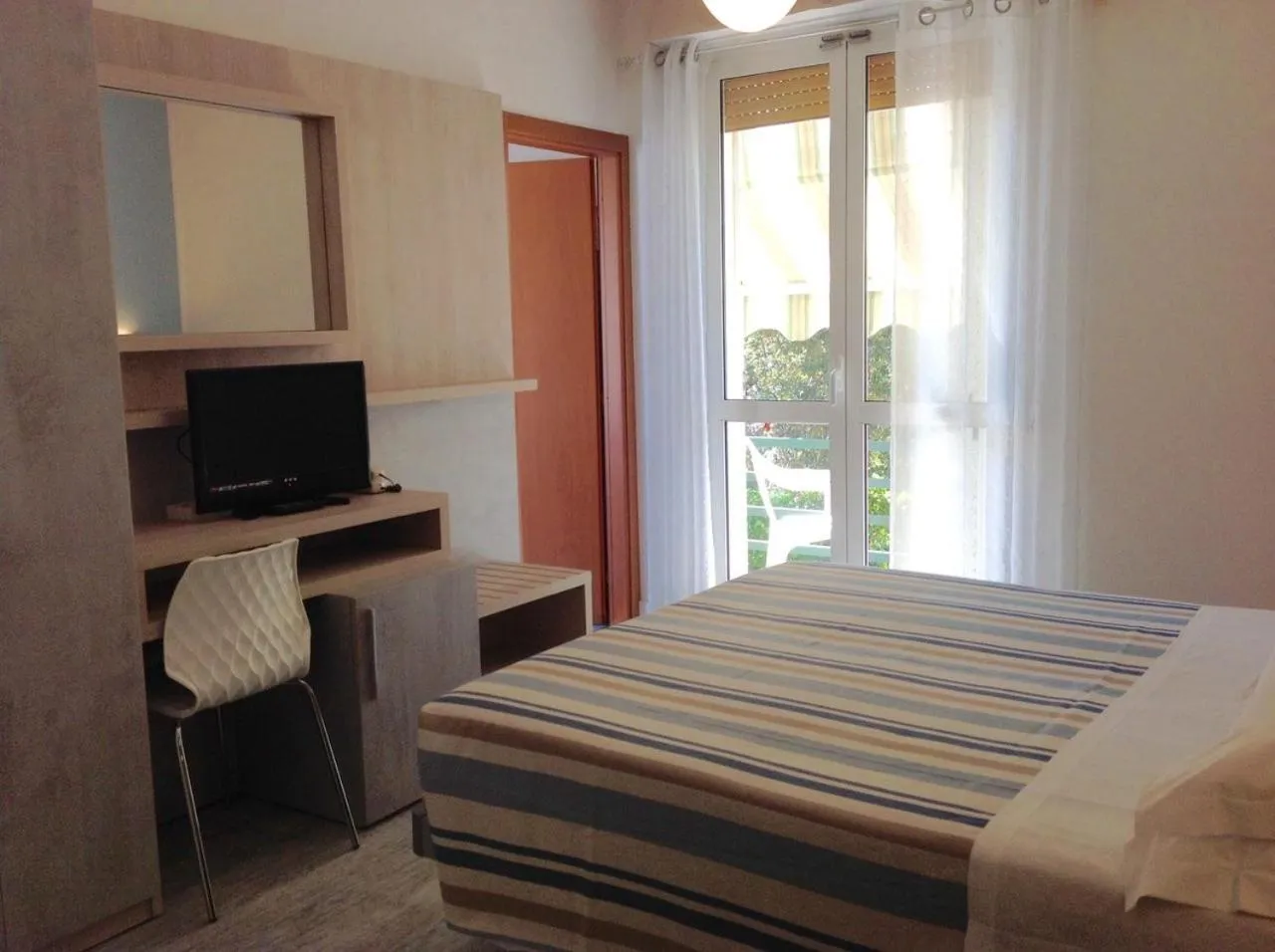 Bedroom in La Coccinella Residence