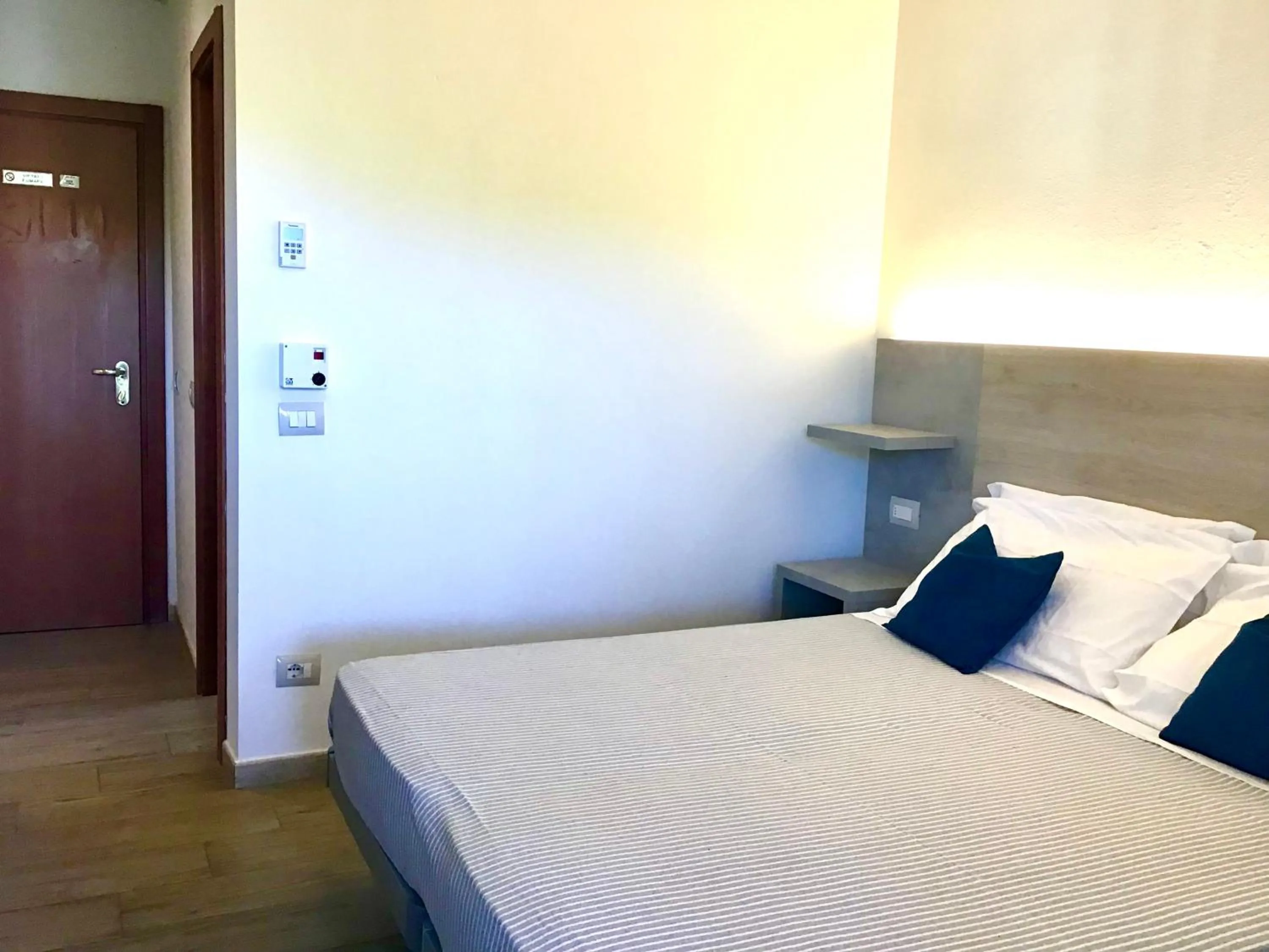 Bedroom in La Coccinella Residence