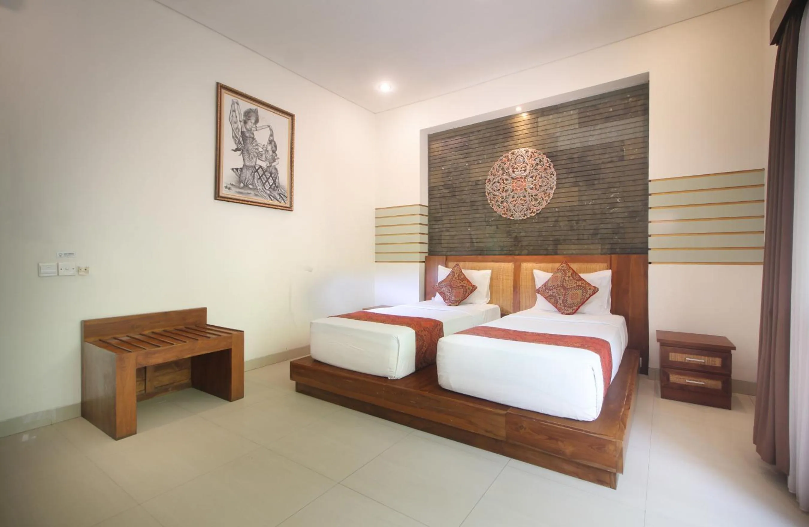 Bed in Putri Ayu Cottages