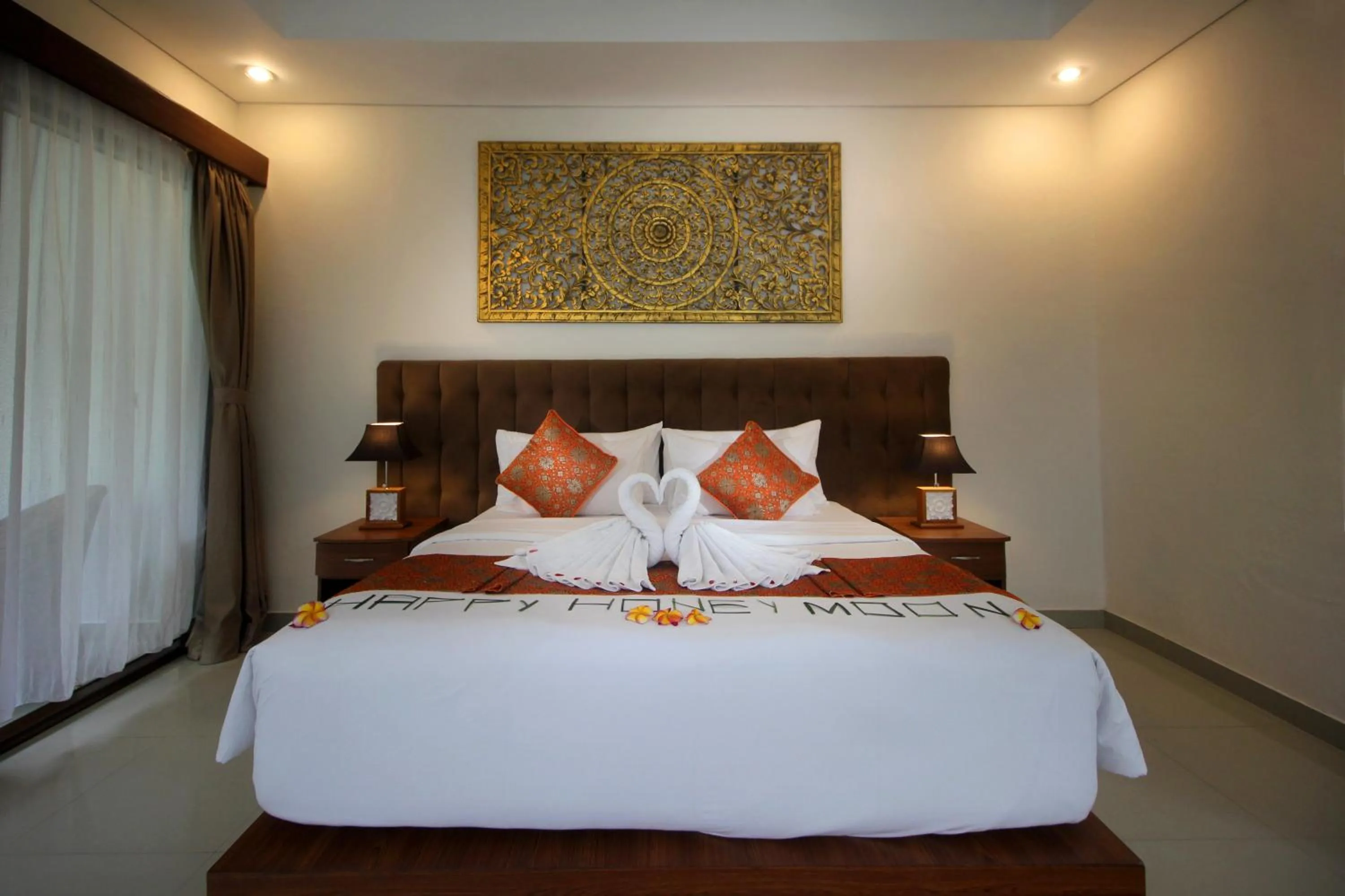 Bed in Putri Ayu Cottages