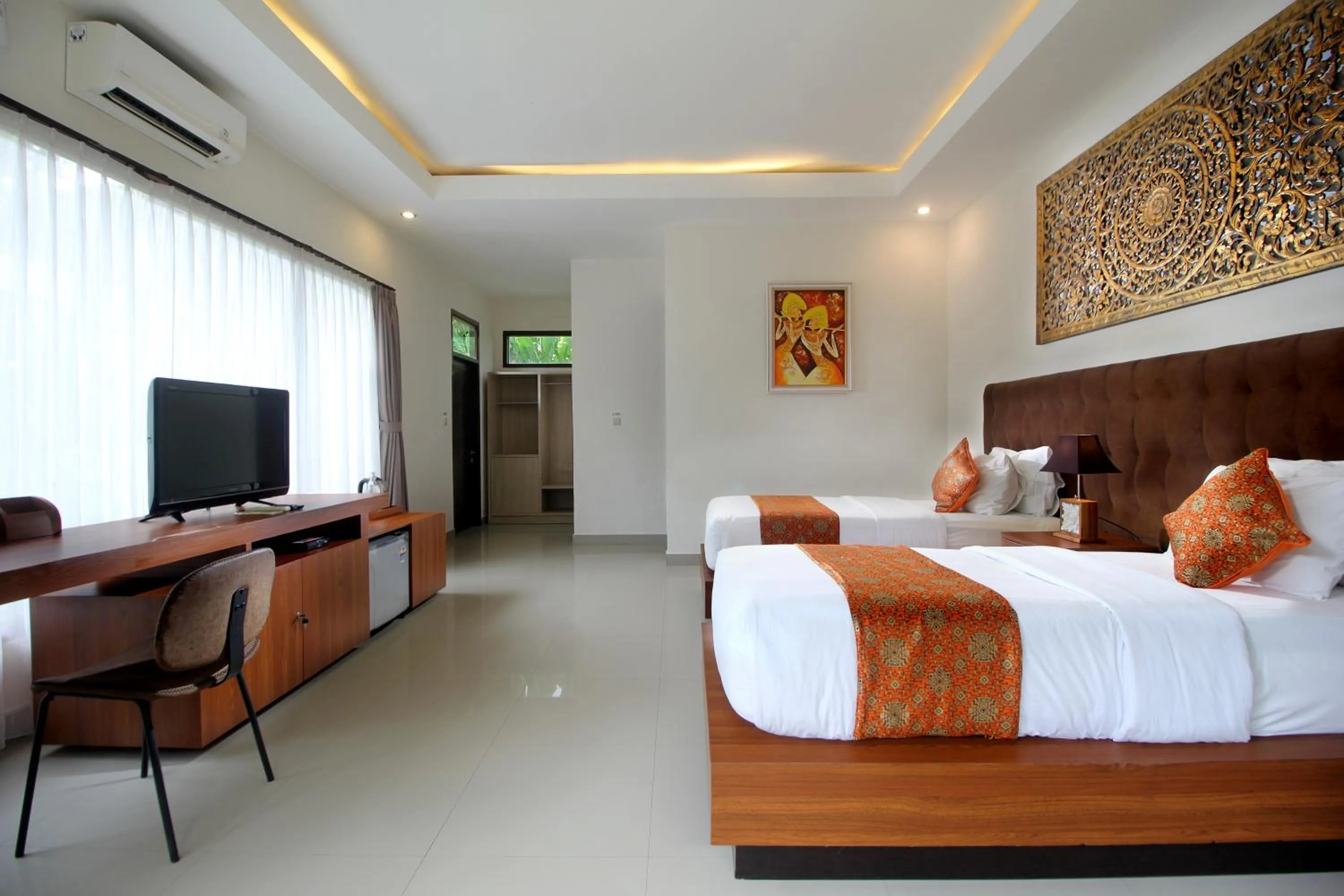 Bed in Putri Ayu Cottages