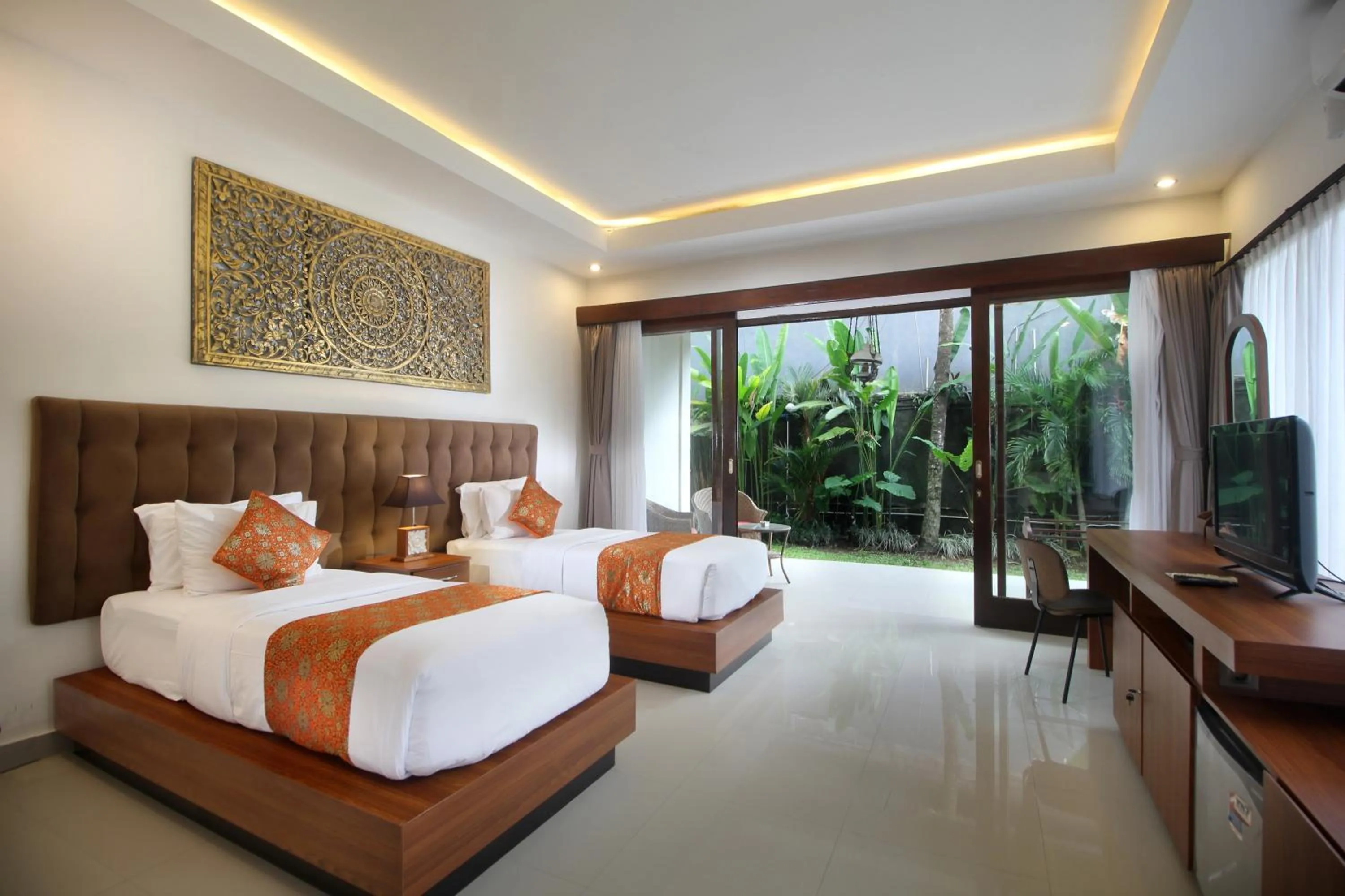 Bed in Putri Ayu Cottages