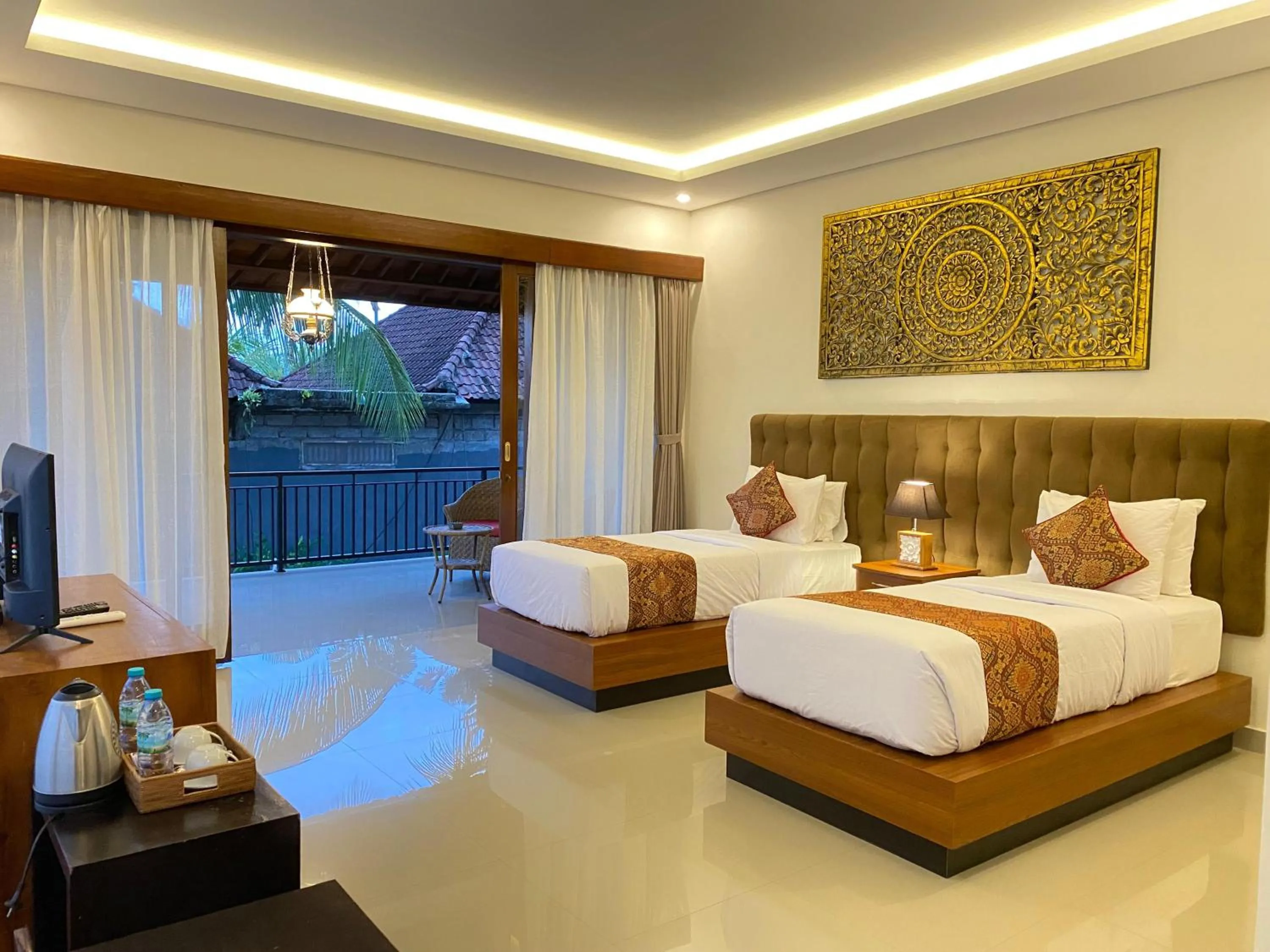 Bed in Putri Ayu Cottages