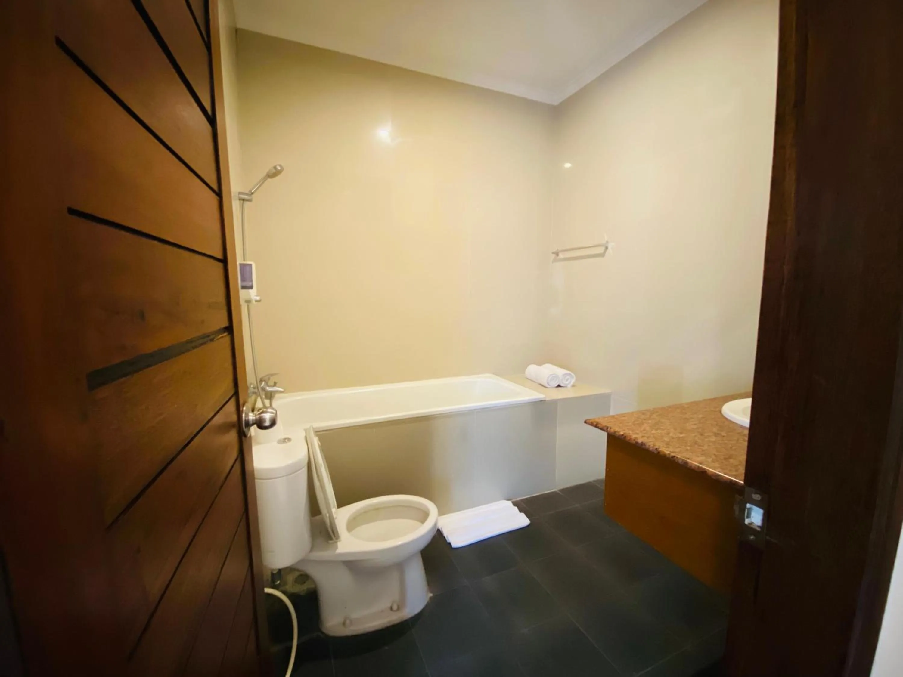 Shower in Putri Ayu Cottages