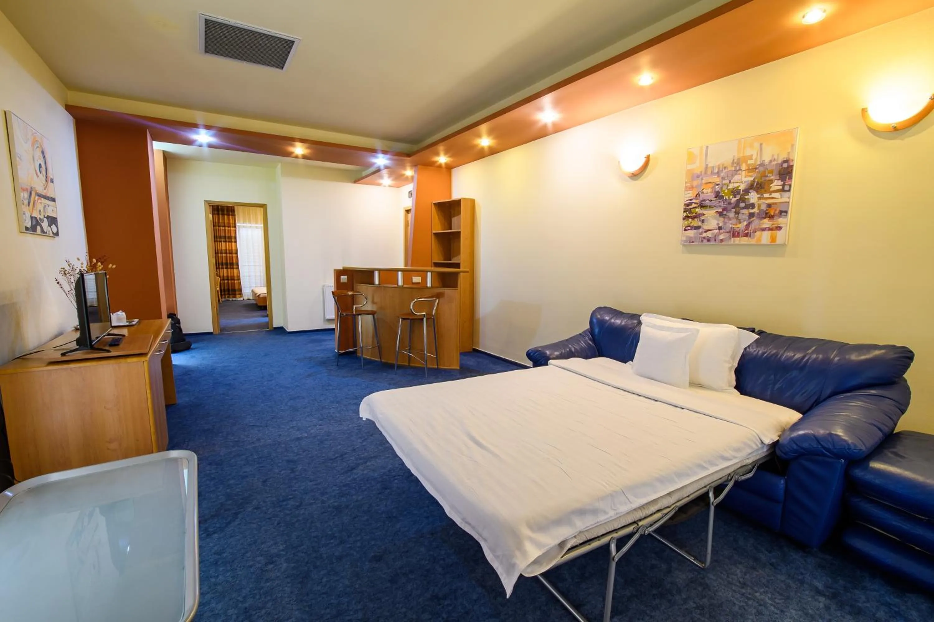 Living room, Bed in Hotel Torontal