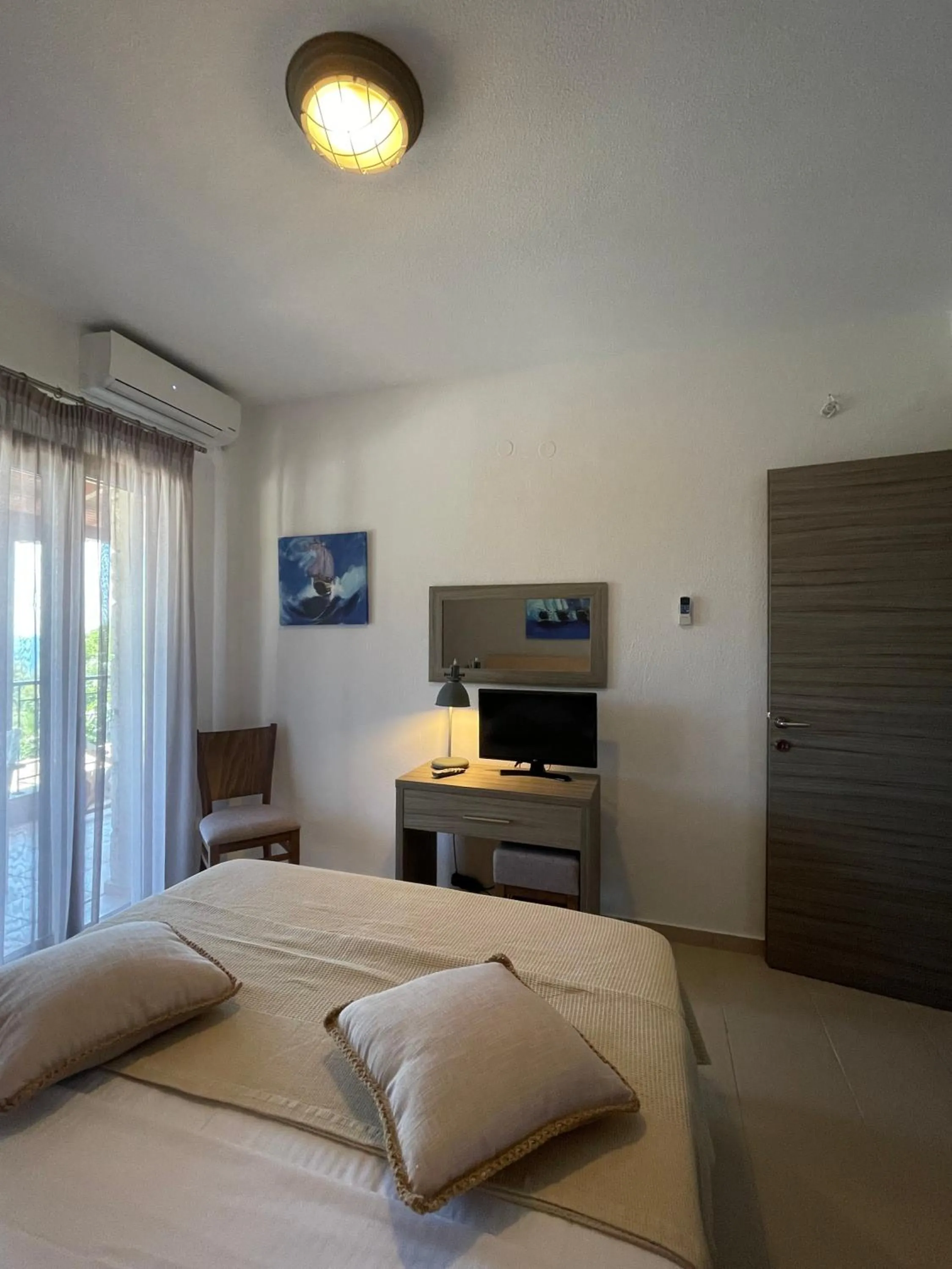 Bed in Koumaros Aparthotel