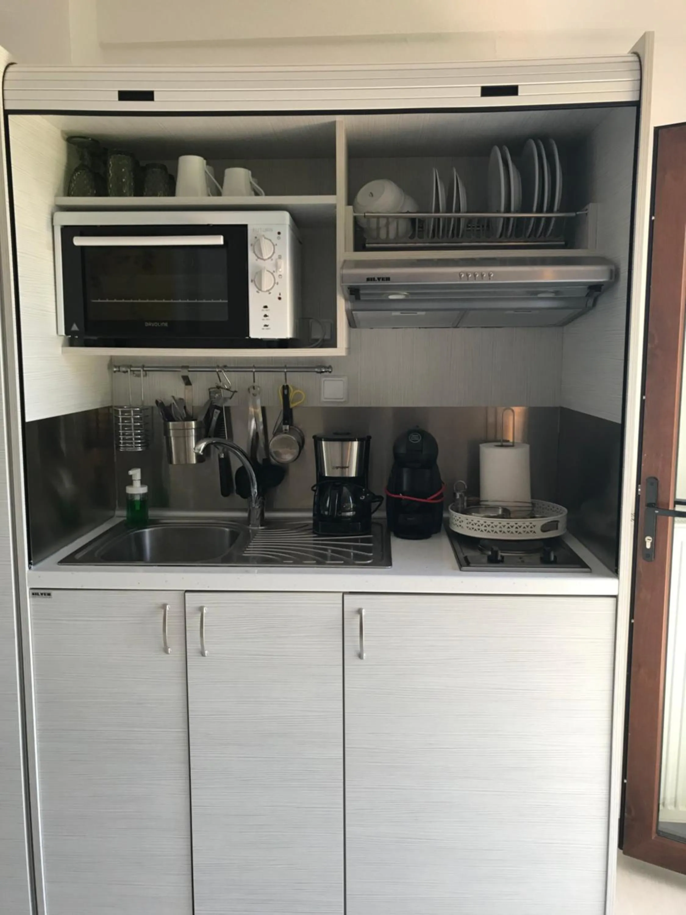 Kitchen or kitchenette in Koumaros Aparthotel