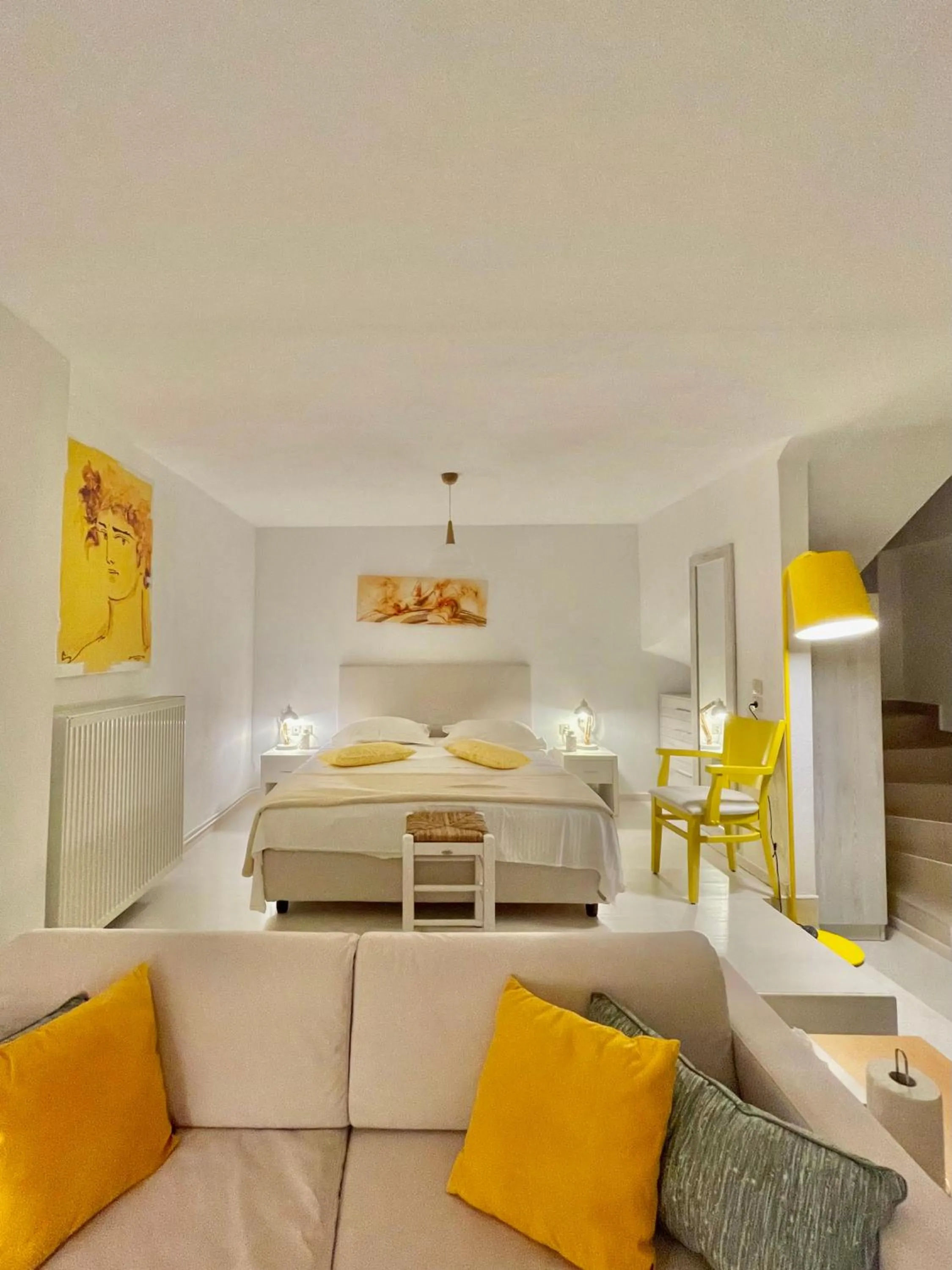 Seating area, Bed in Koumaros Aparthotel