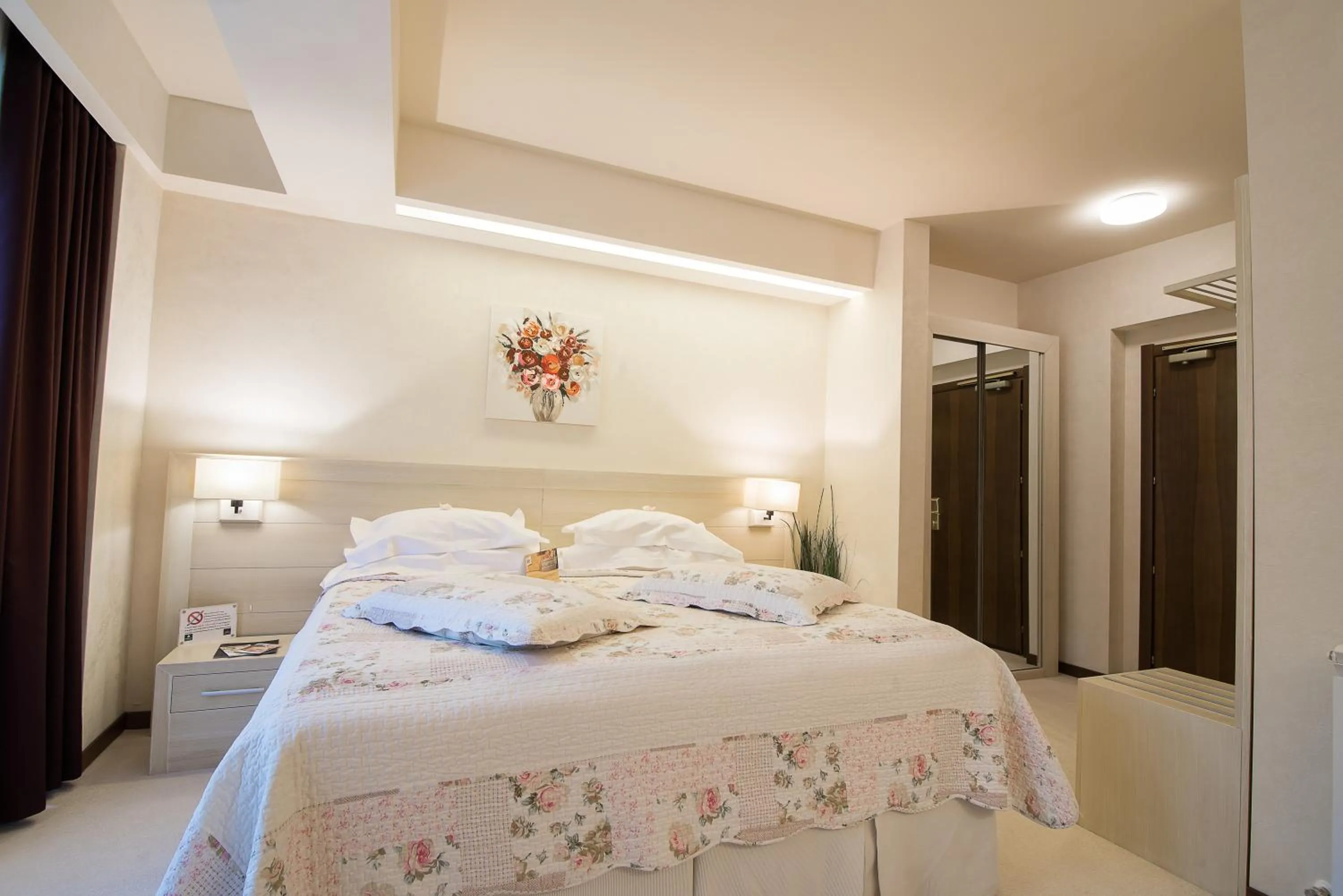 Bed in Ioana Boutique Hotel