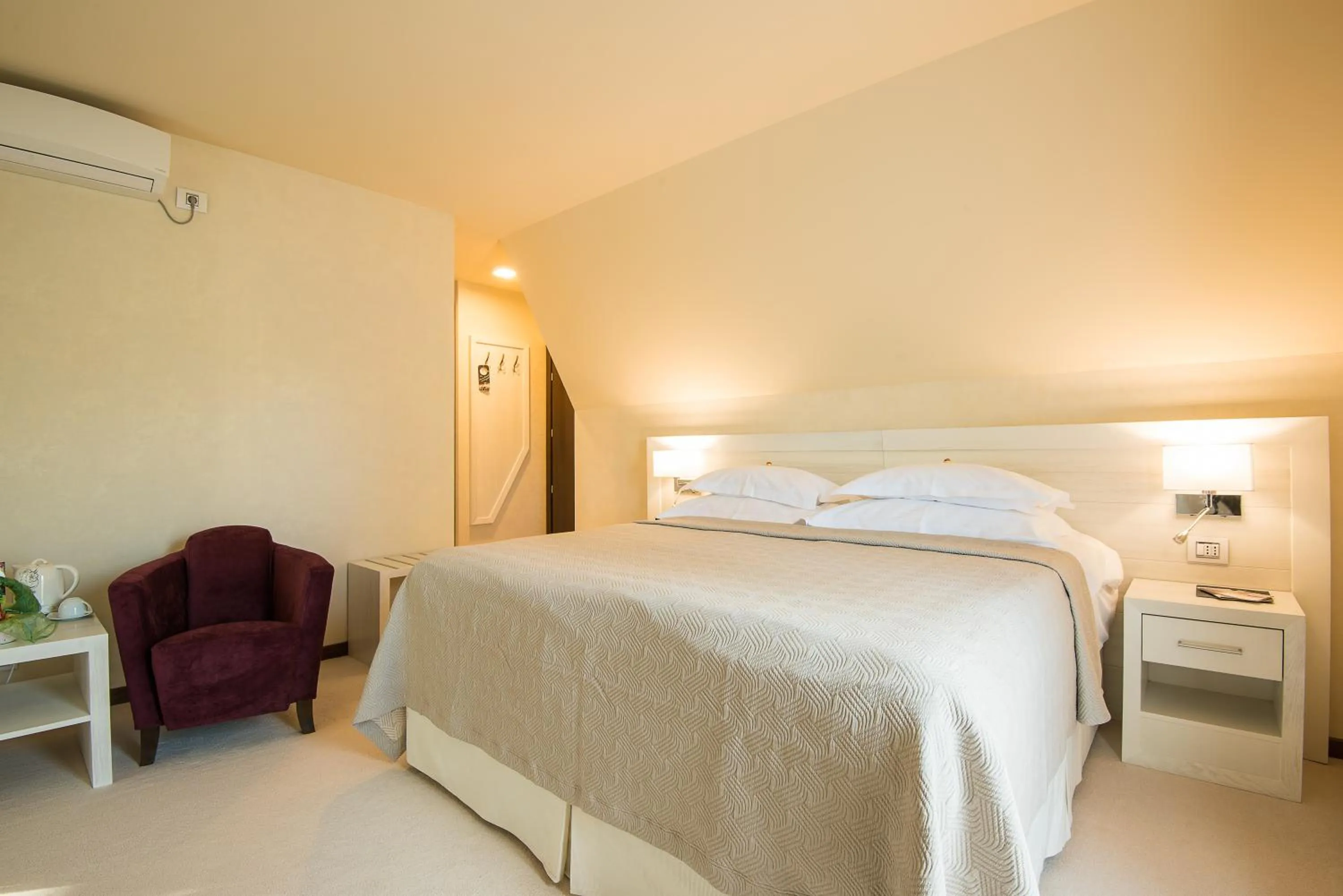 Bed in Ioana Boutique Hotel