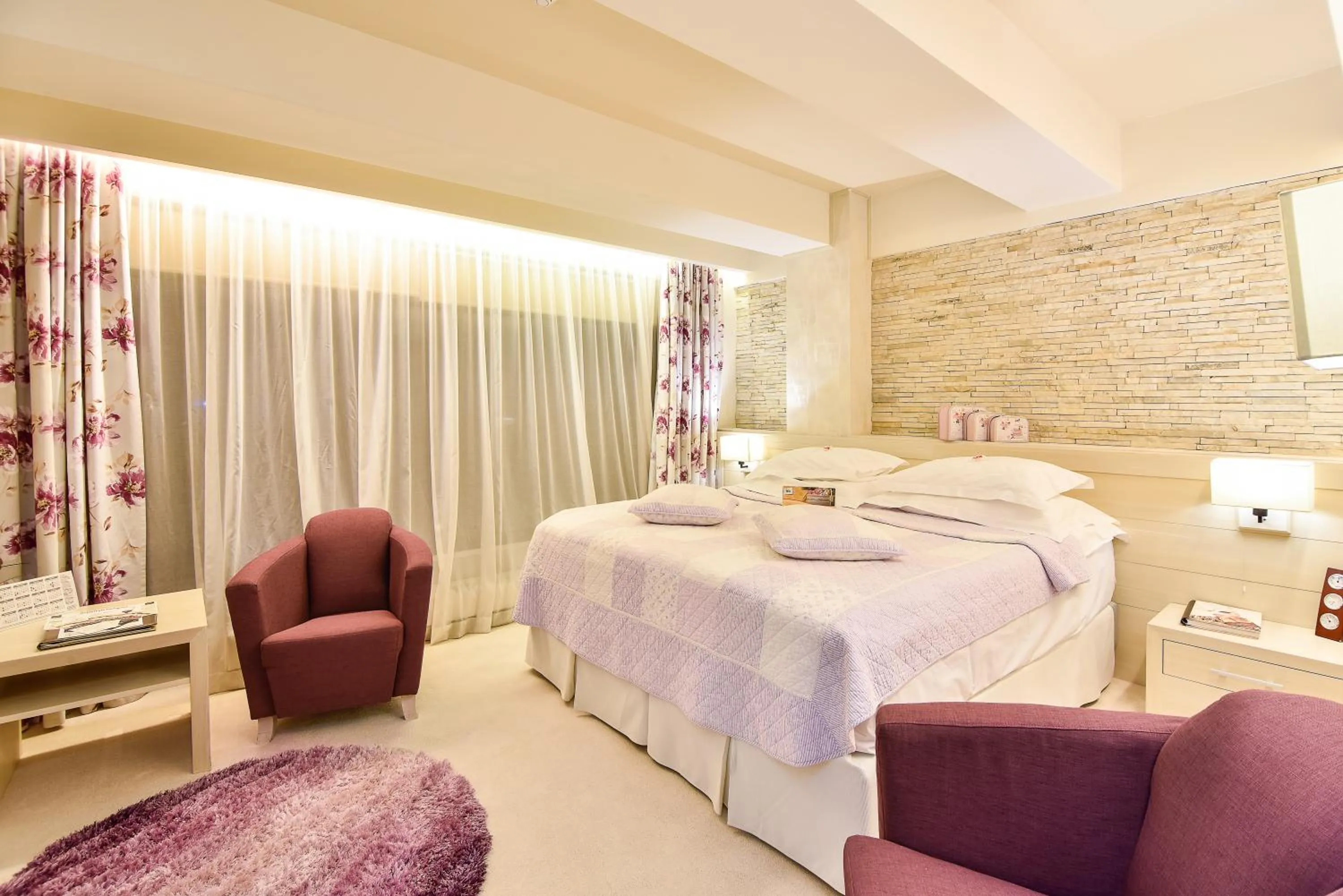 Bed in Ioana Boutique Hotel