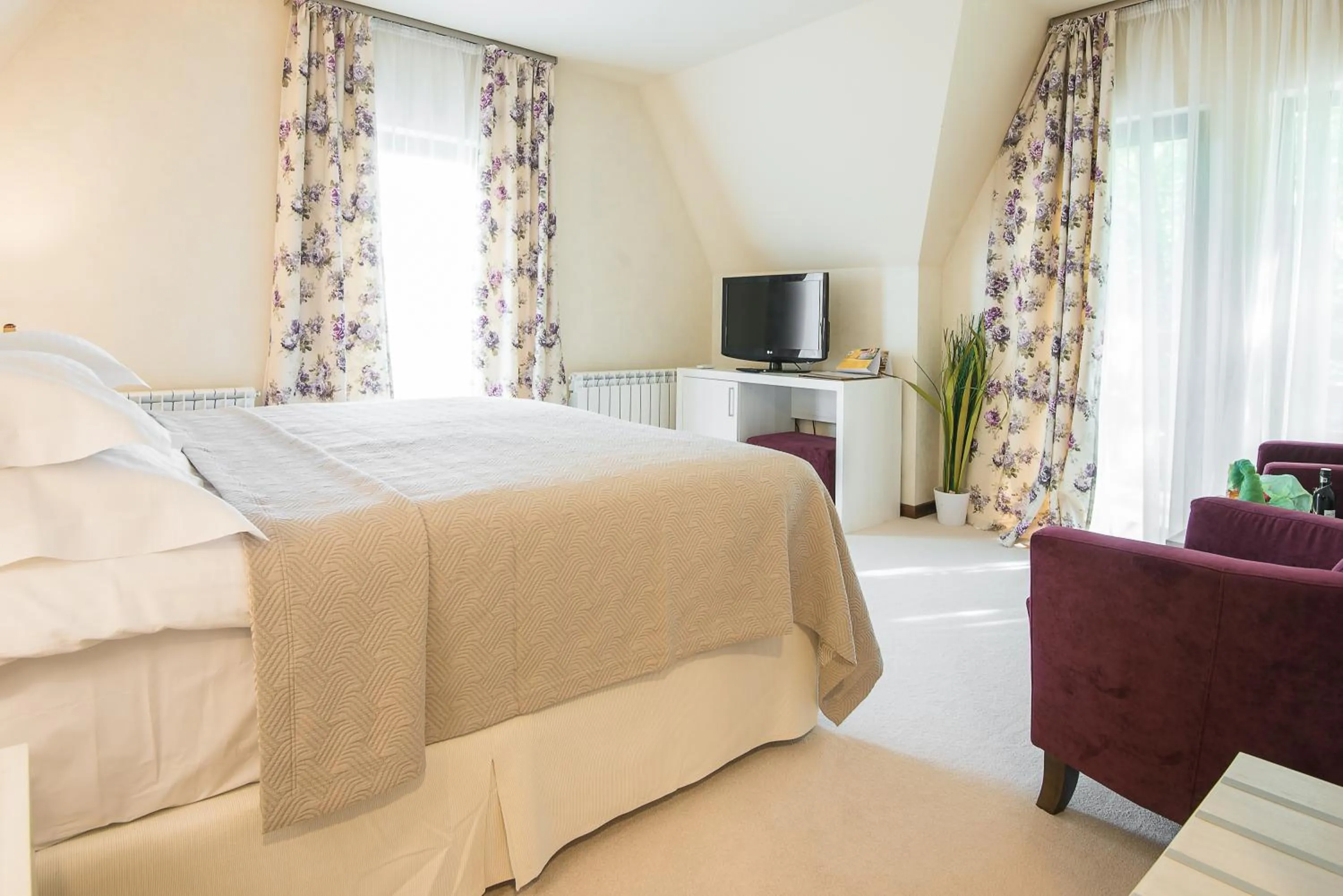 Bed in Ioana Boutique Hotel