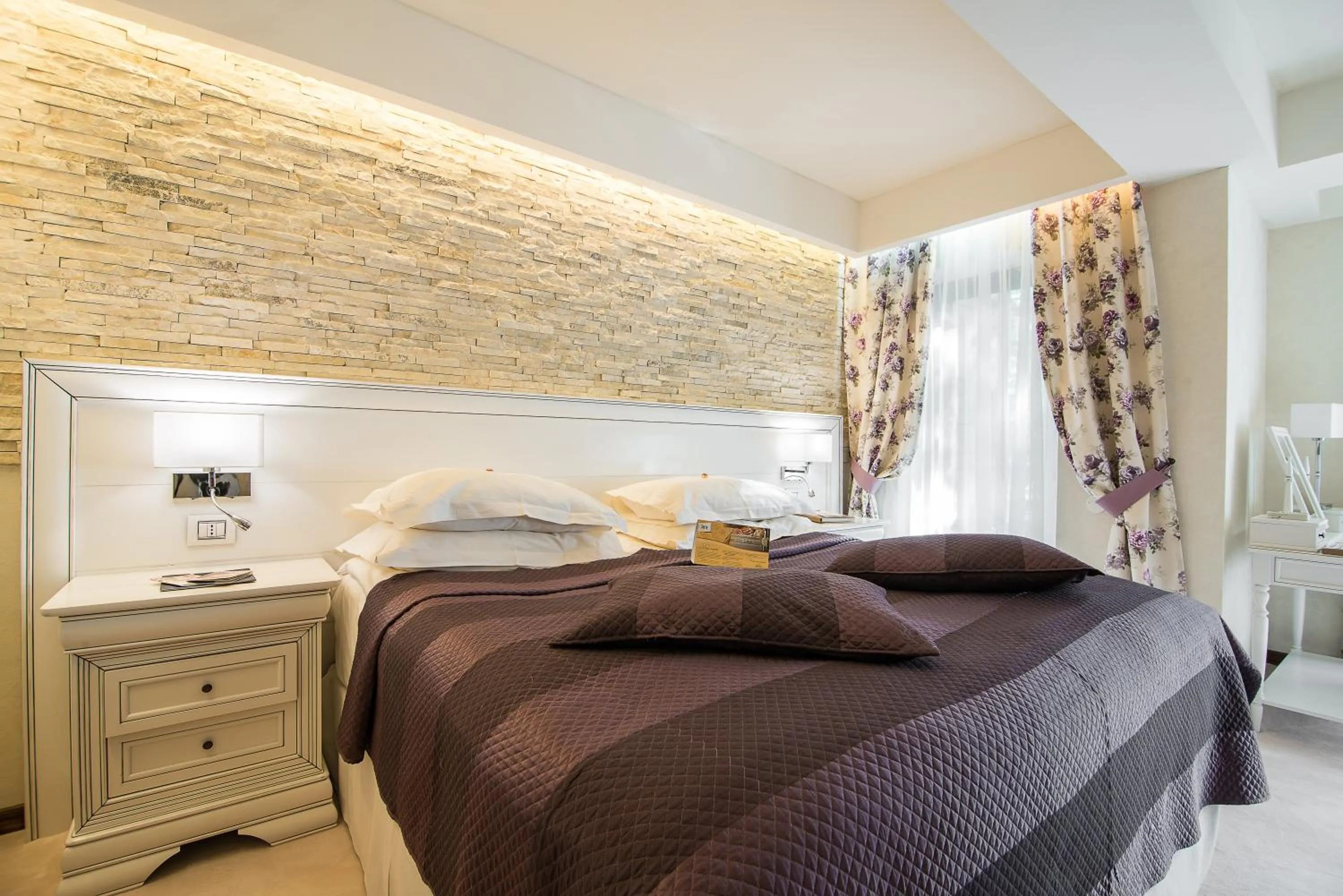 Bed in Ioana Boutique Hotel