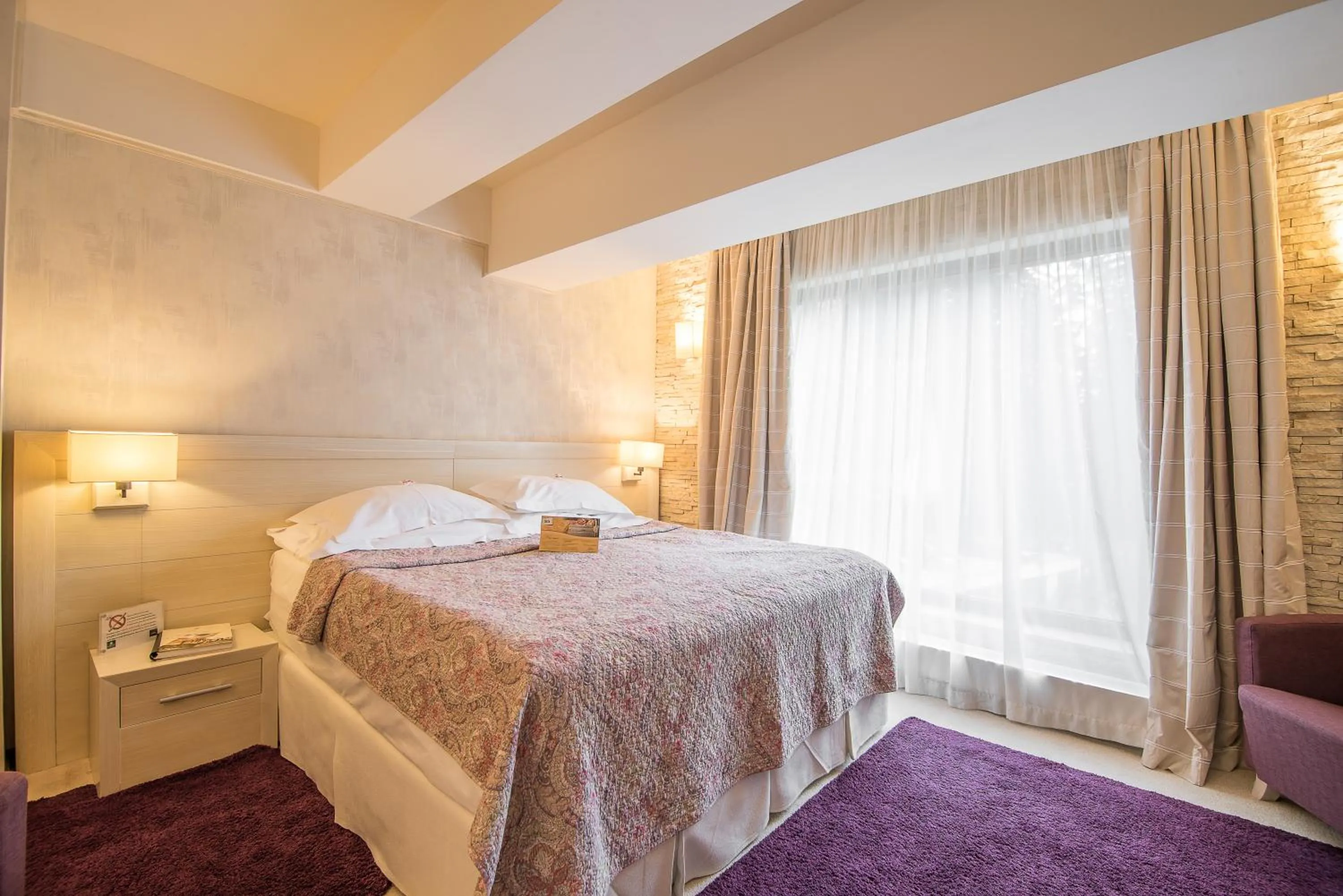 Bed in Ioana Boutique Hotel