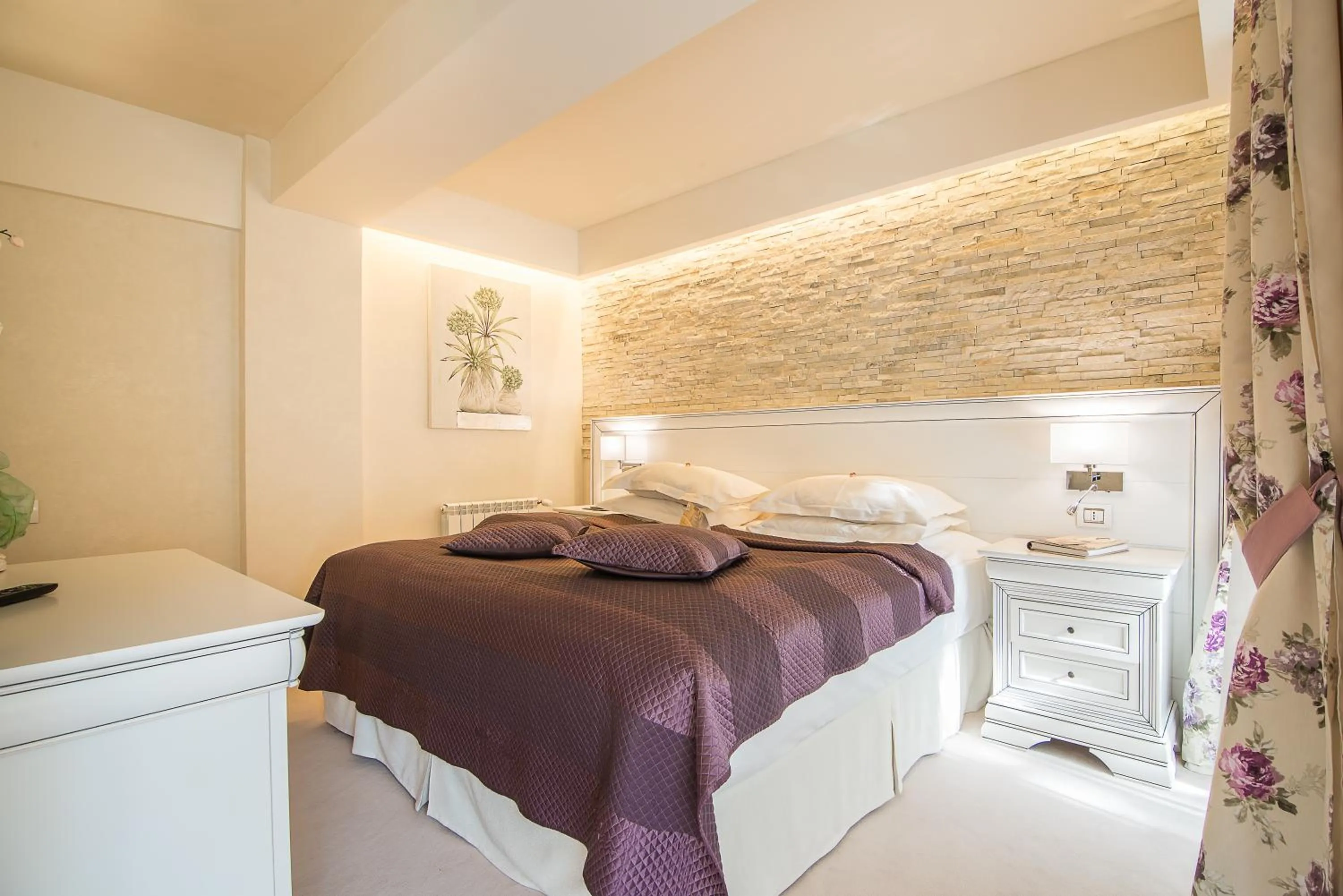 Bed in Ioana Boutique Hotel