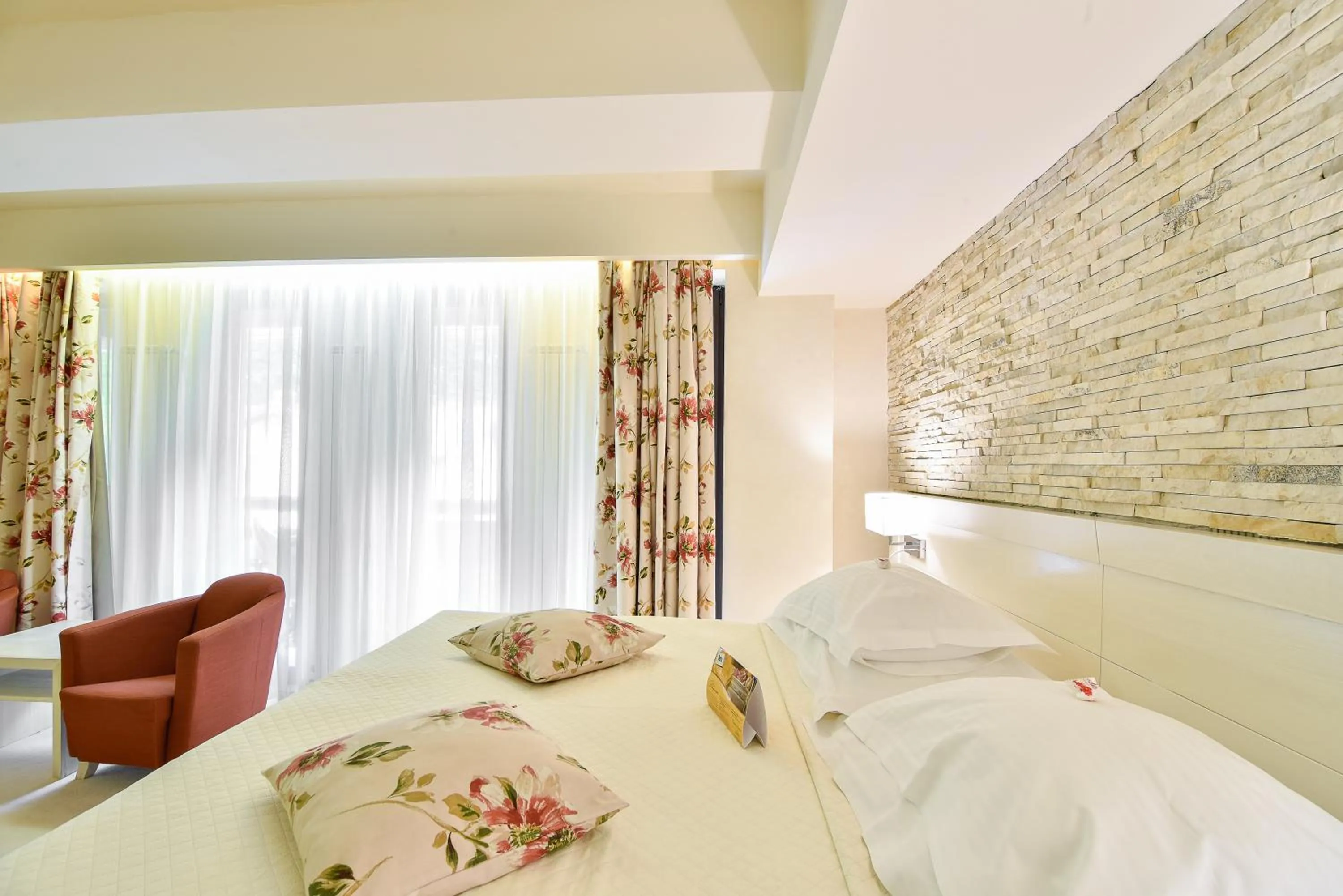 Bed in Ioana Boutique Hotel