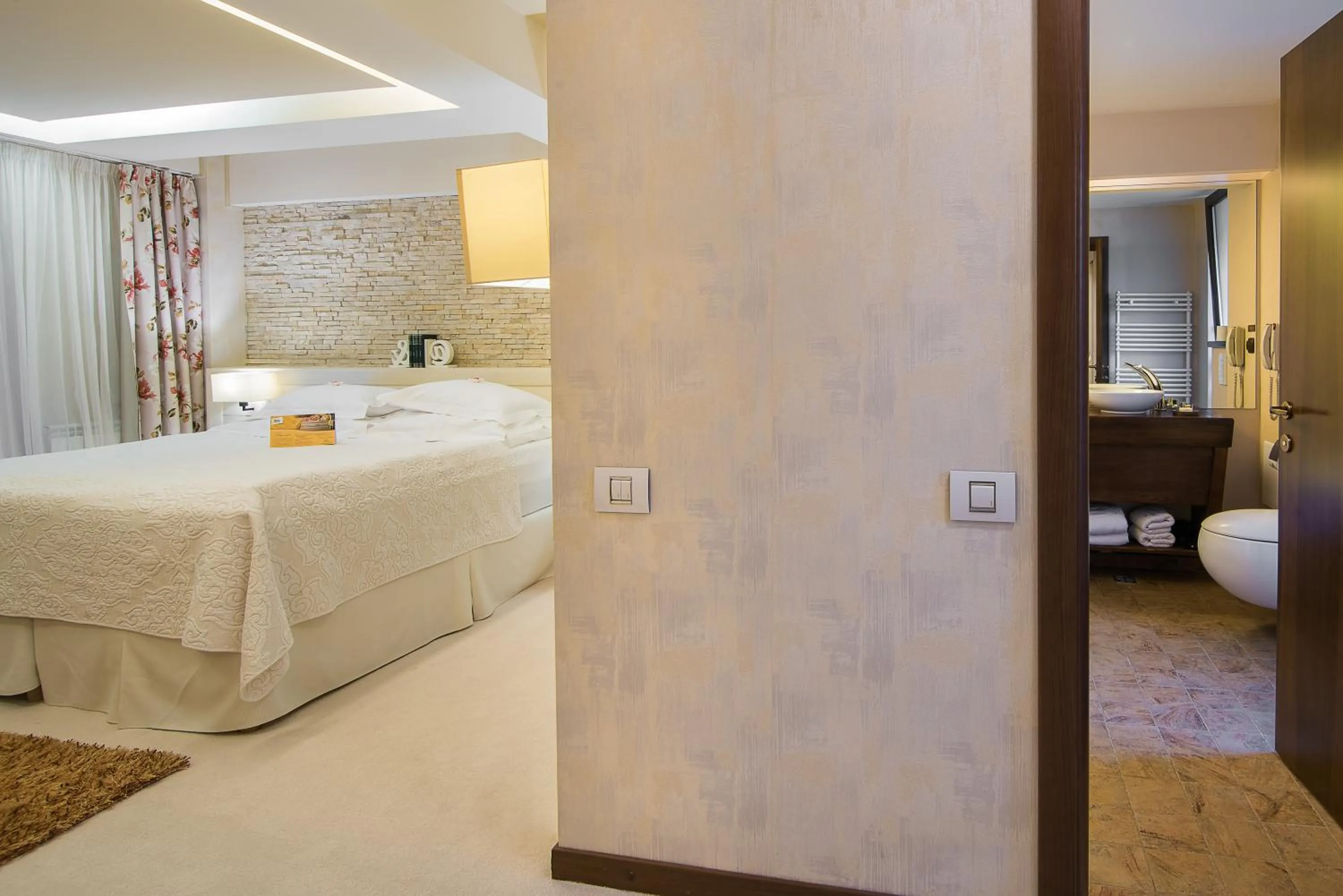 Bed in Ioana Boutique Hotel