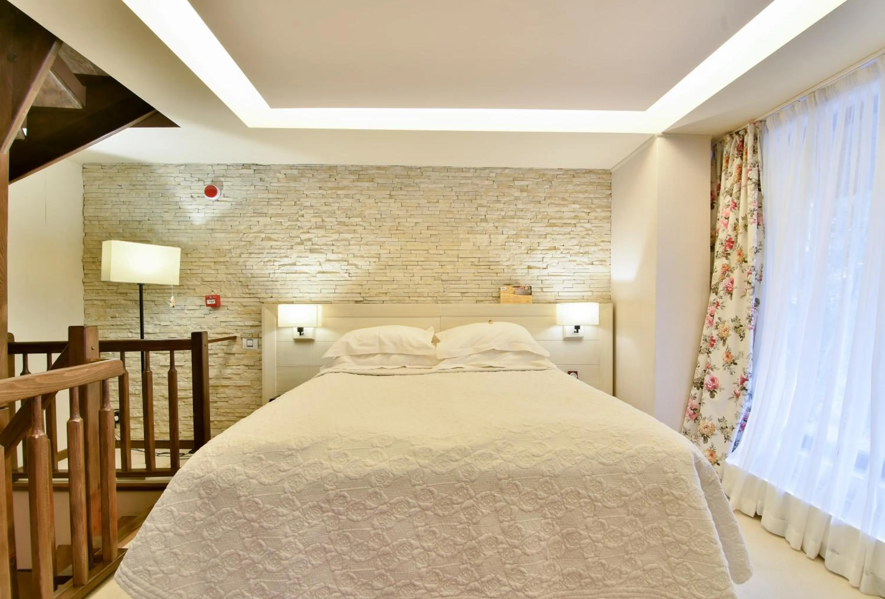 Bed in Ioana Boutique Hotel