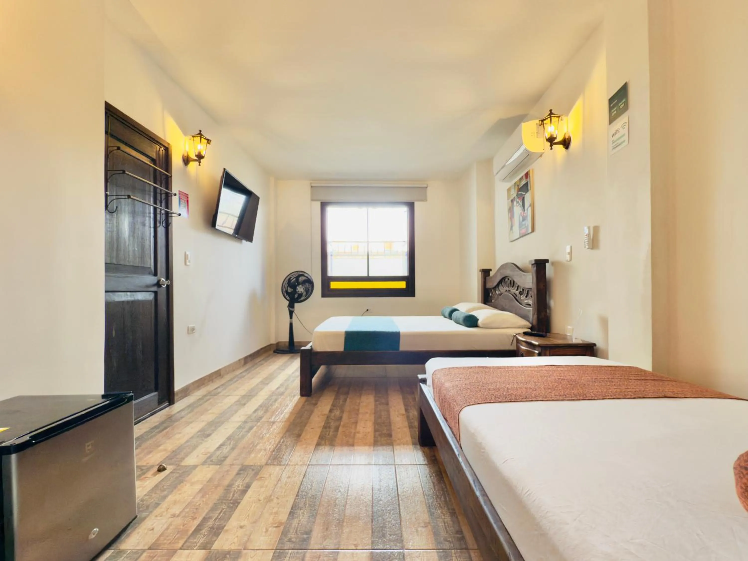 Photo of the whole room, Bed in Santiago DC Hotel