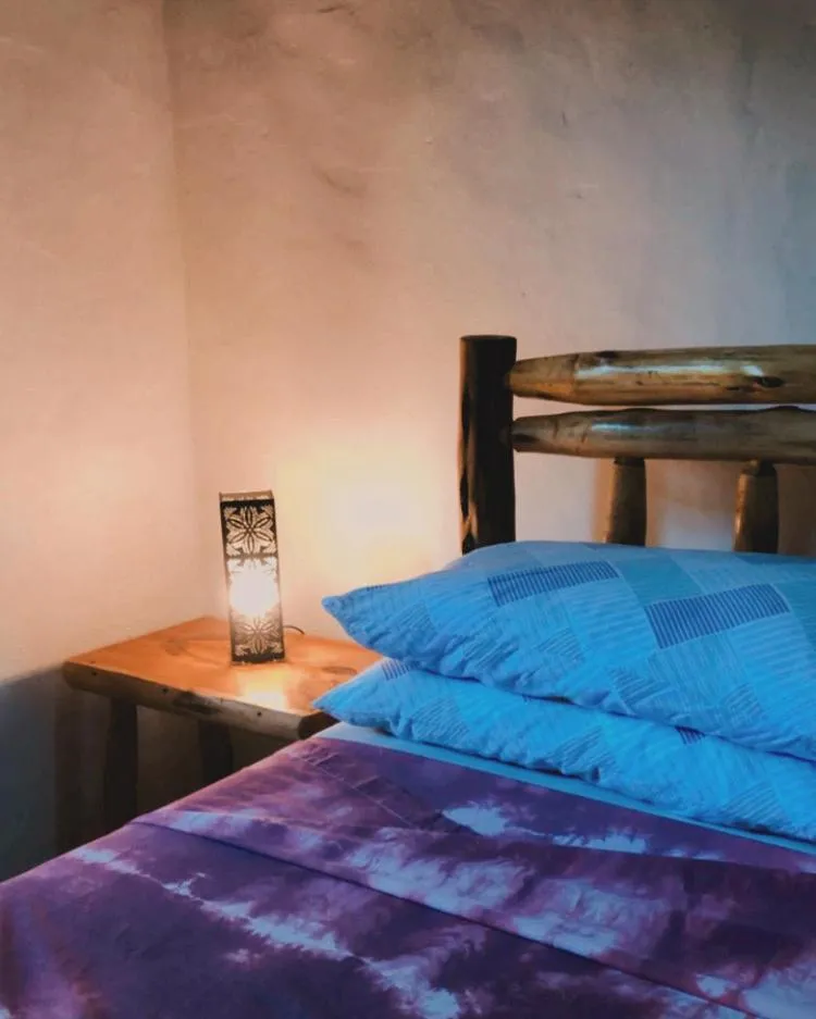 Bed in Recanto das Bromélias Chalés