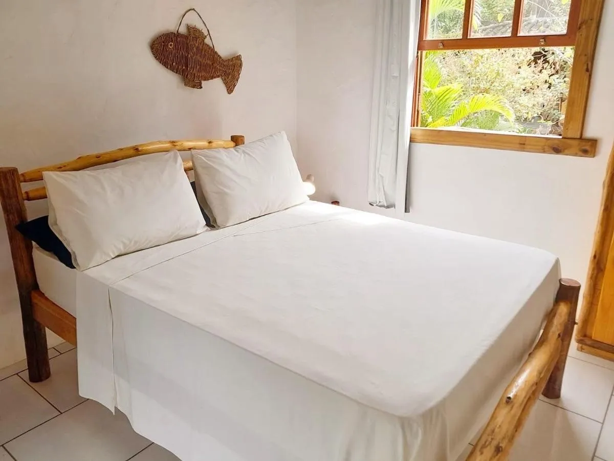 Bed in Recanto das Bromélias Chalés