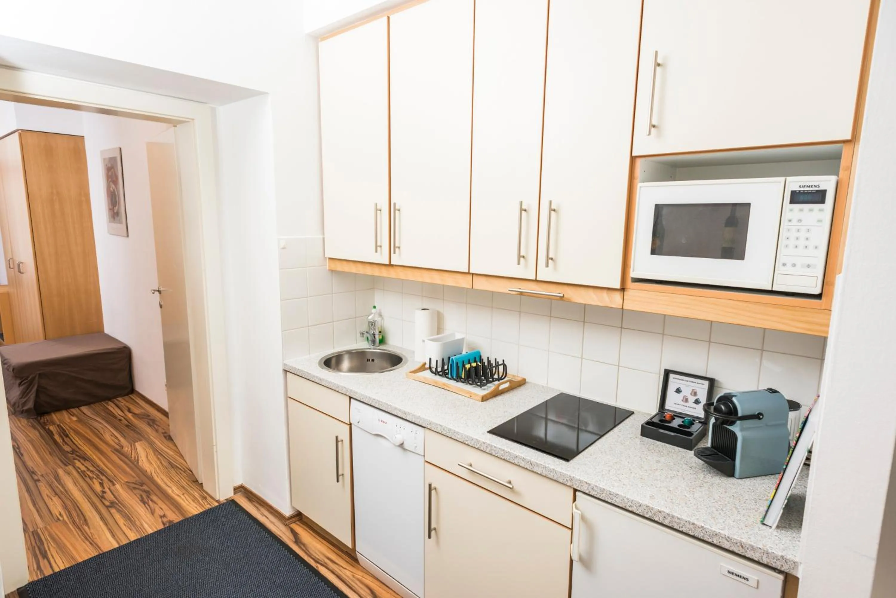 Kitchen or kitchenette in Appartements Ferchergasse