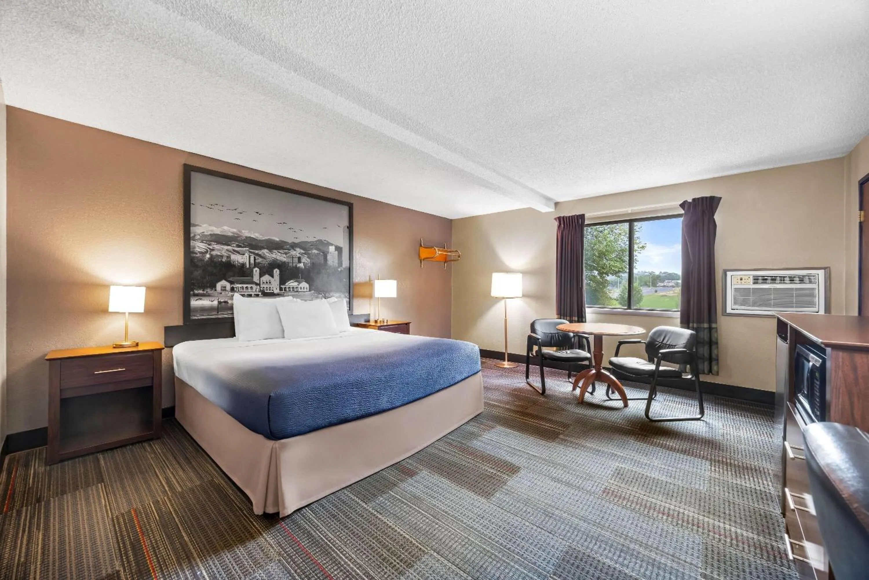 Bed in Super 8 by Wyndham Colorado Springs Peterson Space Force