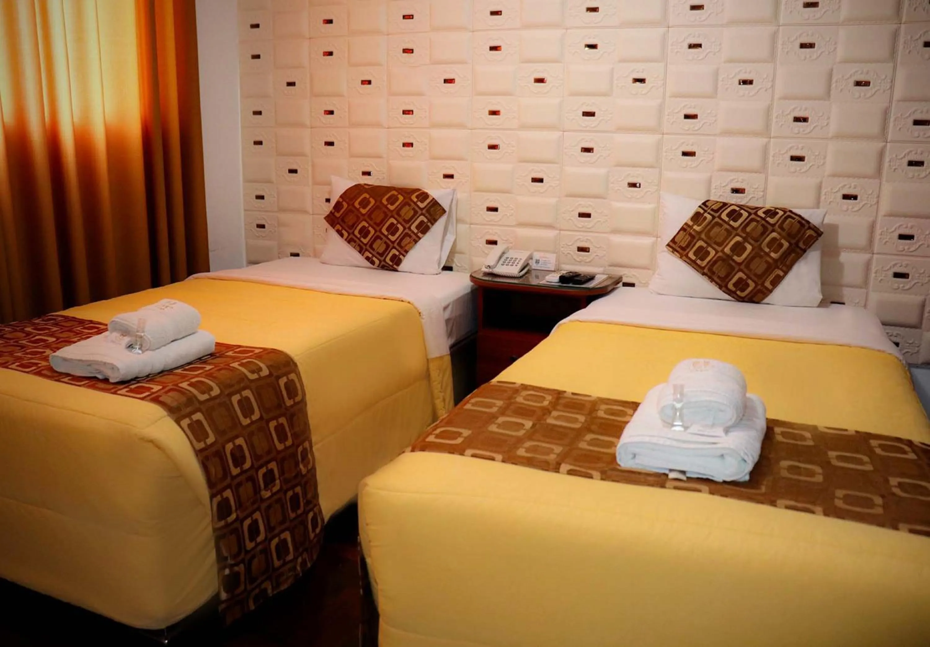 Bed in Inkari Apart Hotel