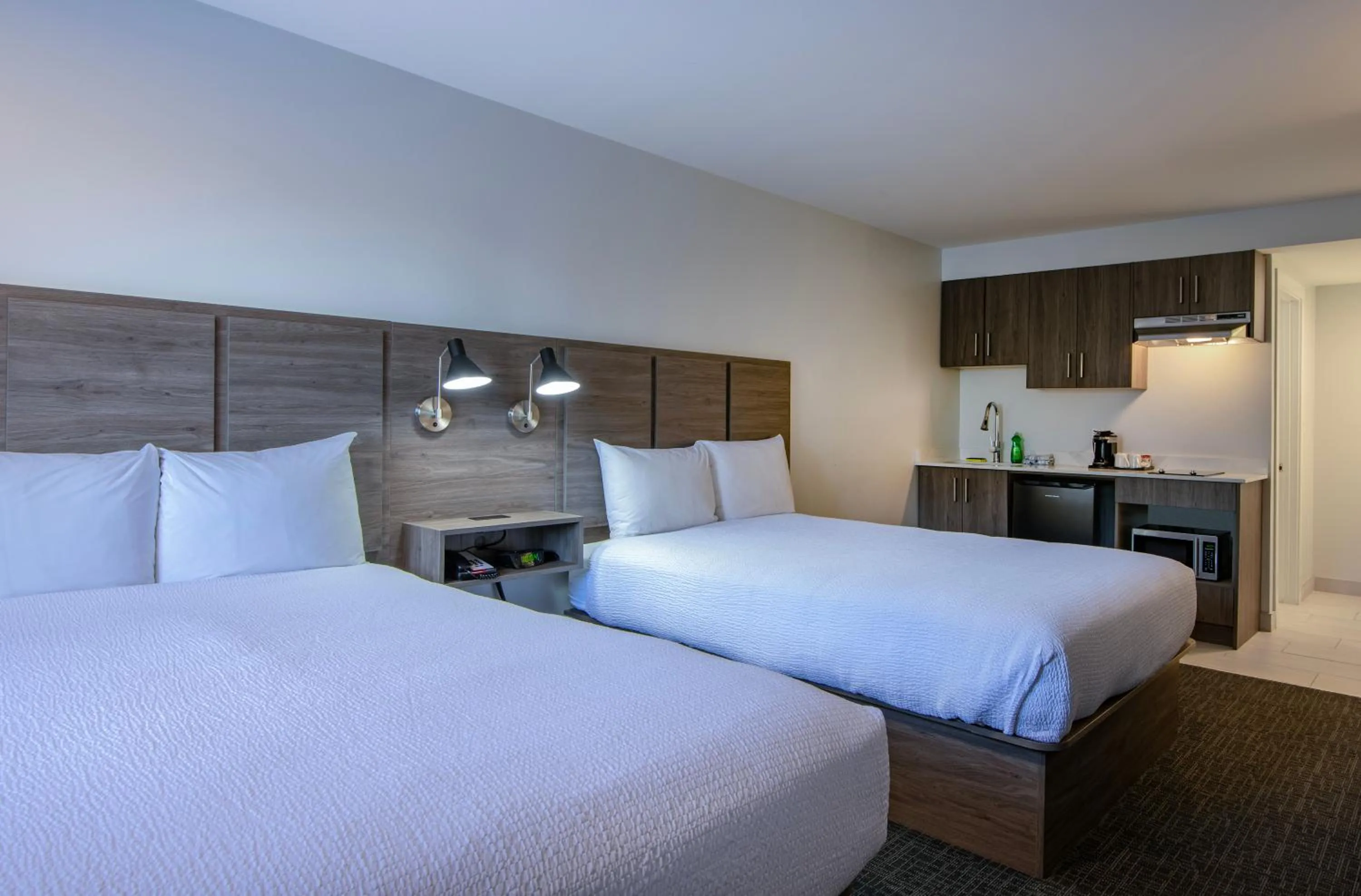 Bed in Riverland Inn & Suites