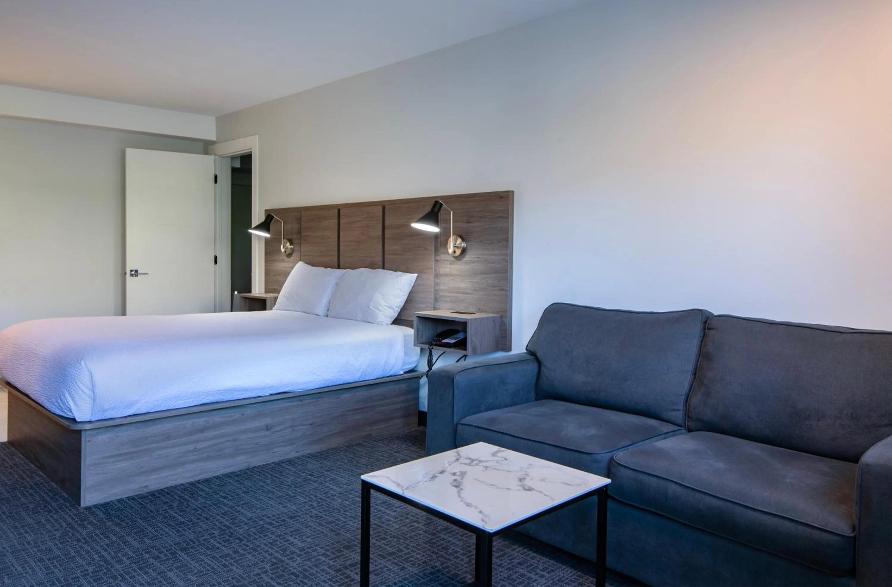 Bed in Riverland Inn & Suites