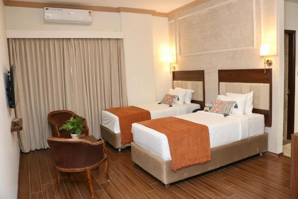 Bed in Nalapad's Hotel Bangalore International