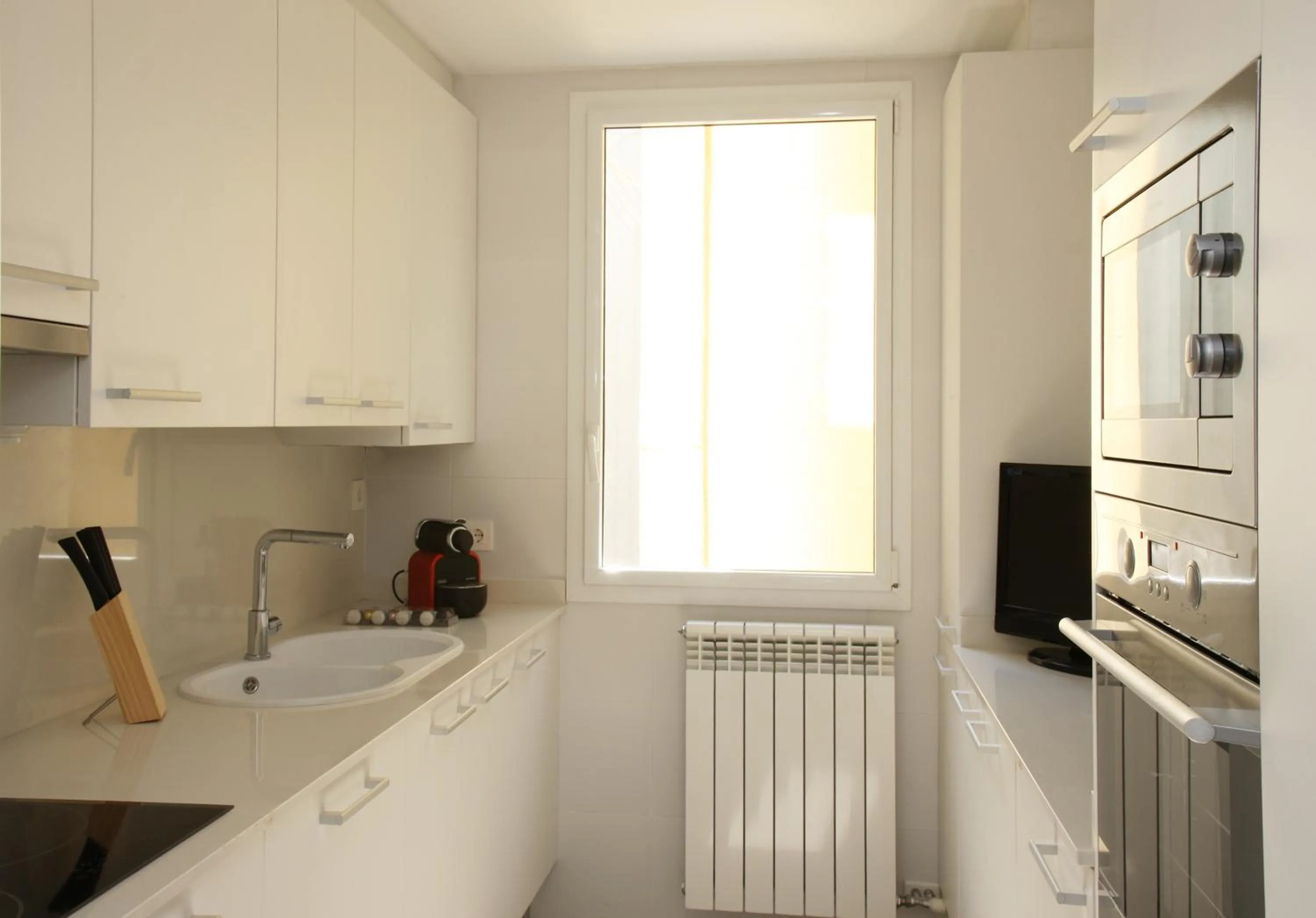 Kitchen or kitchenette in MH Apartments Suites